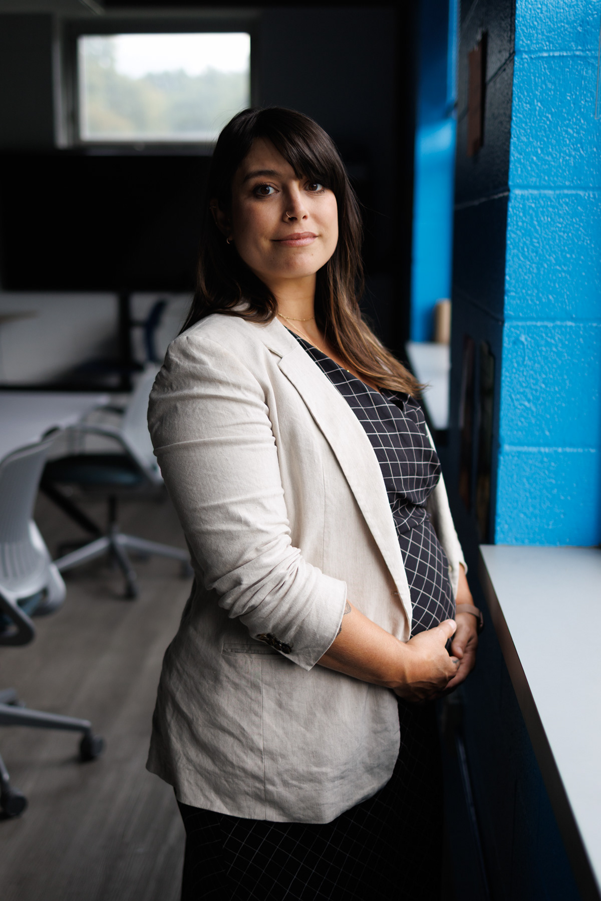 Allegheny County Executive Sara Innamorato, 40, poses for a portrait at Estelle S. Campbell Boys & Girls Club, Friday, Aug. 28, 2026, in Lawrenceville. Innamorato is backing one of the nation’s most ambitious parental leave policies which comes at a time when she is six months pregnant with her first child. (Photo by Danny Arensberg/Pittsburgh’s Public Source)