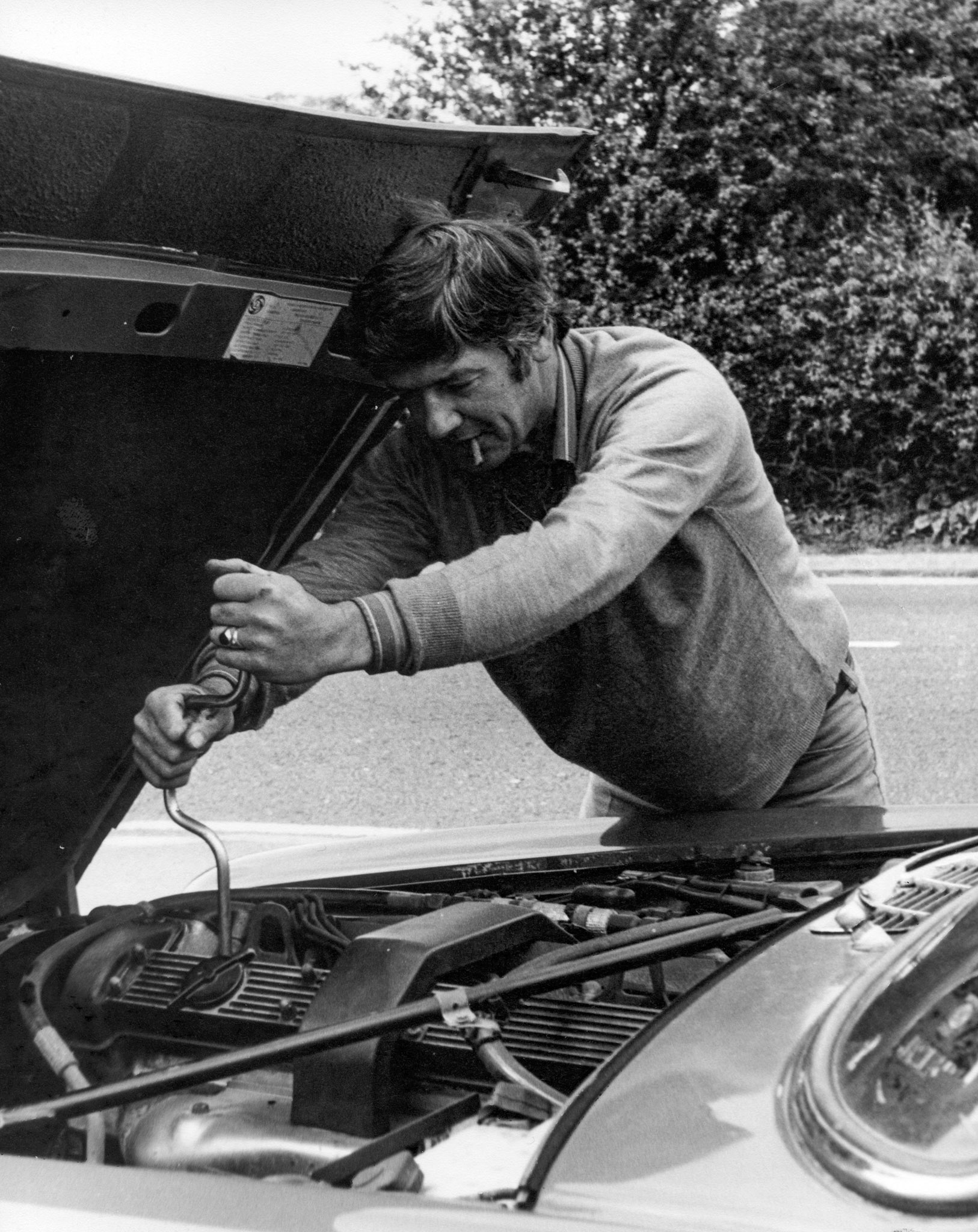 Lance working on a quality car, a Jaguar. 1984