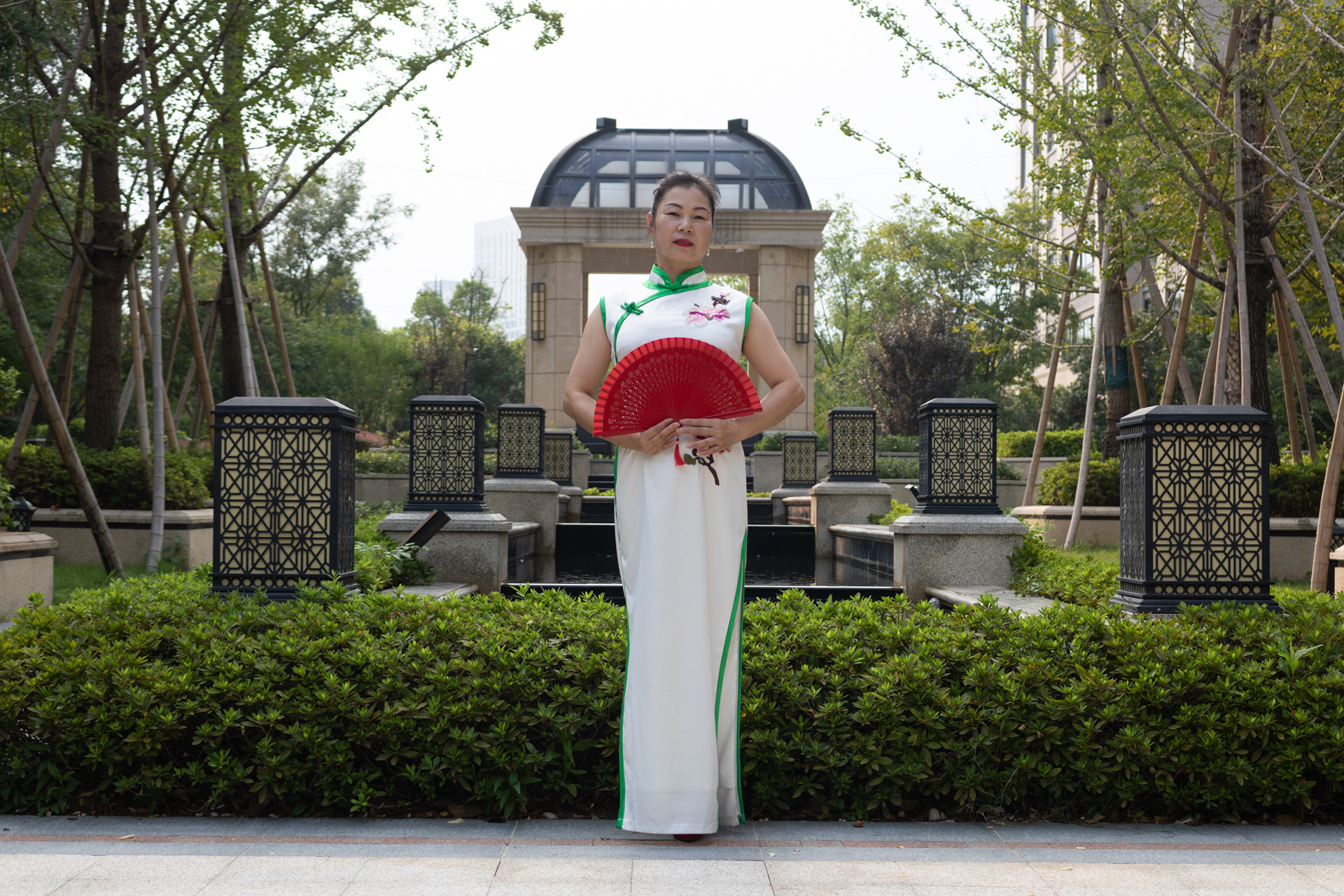 Lady in front of garden, Zhejiang, China