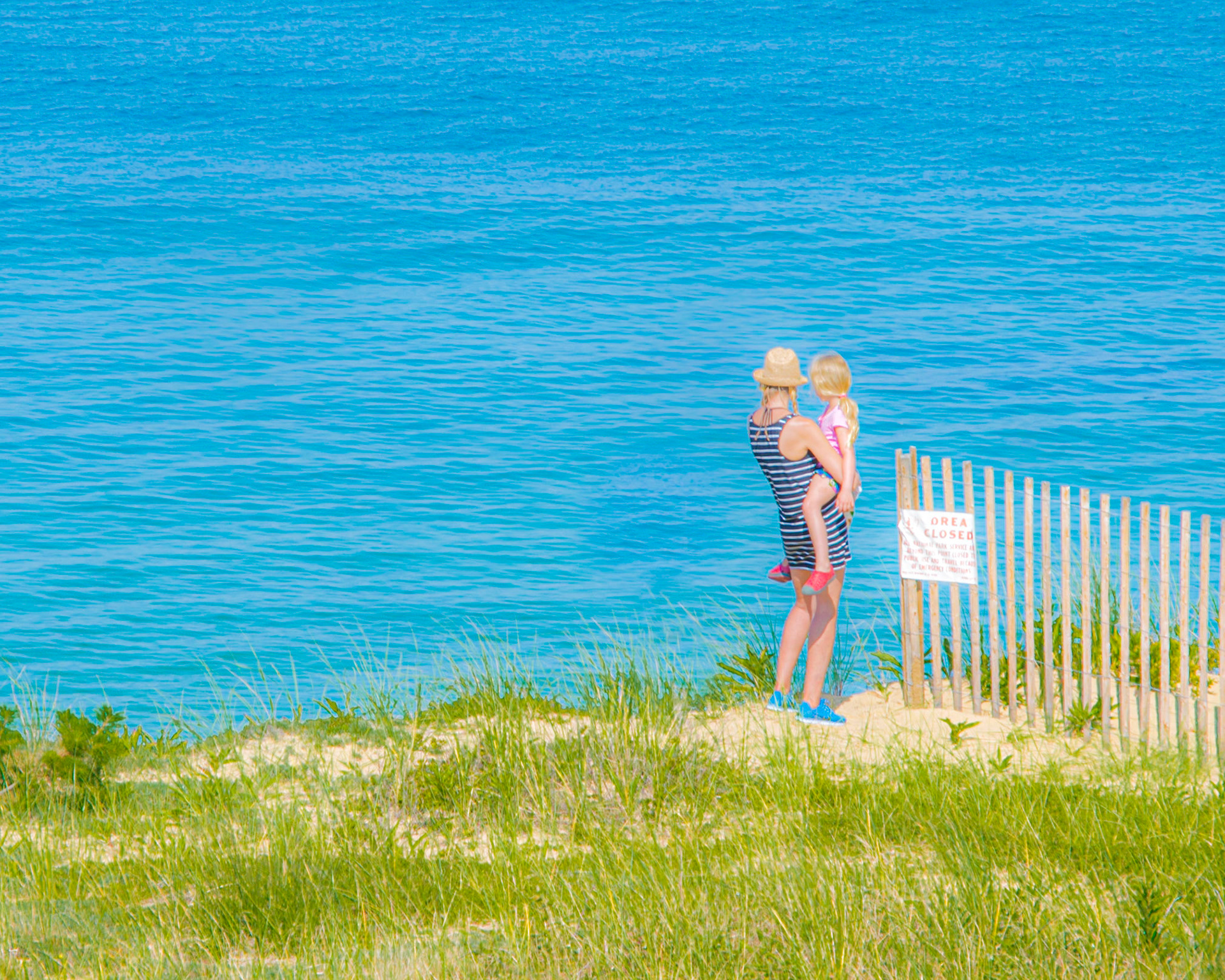 #325 Mom and daughter looking to the other side of the ocean in this watercolor like photo