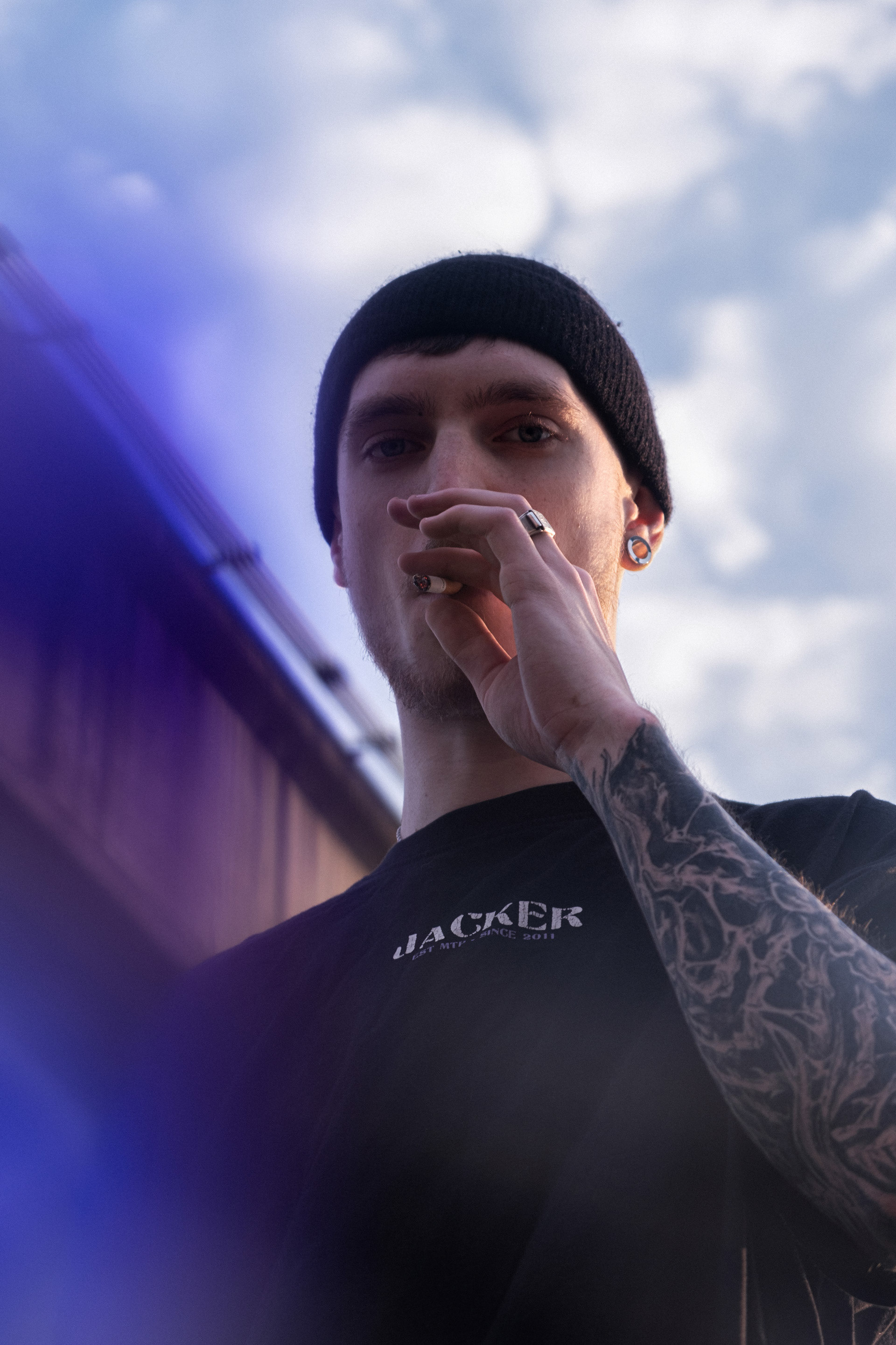 Portrait of Dewitt smoking a cigarette