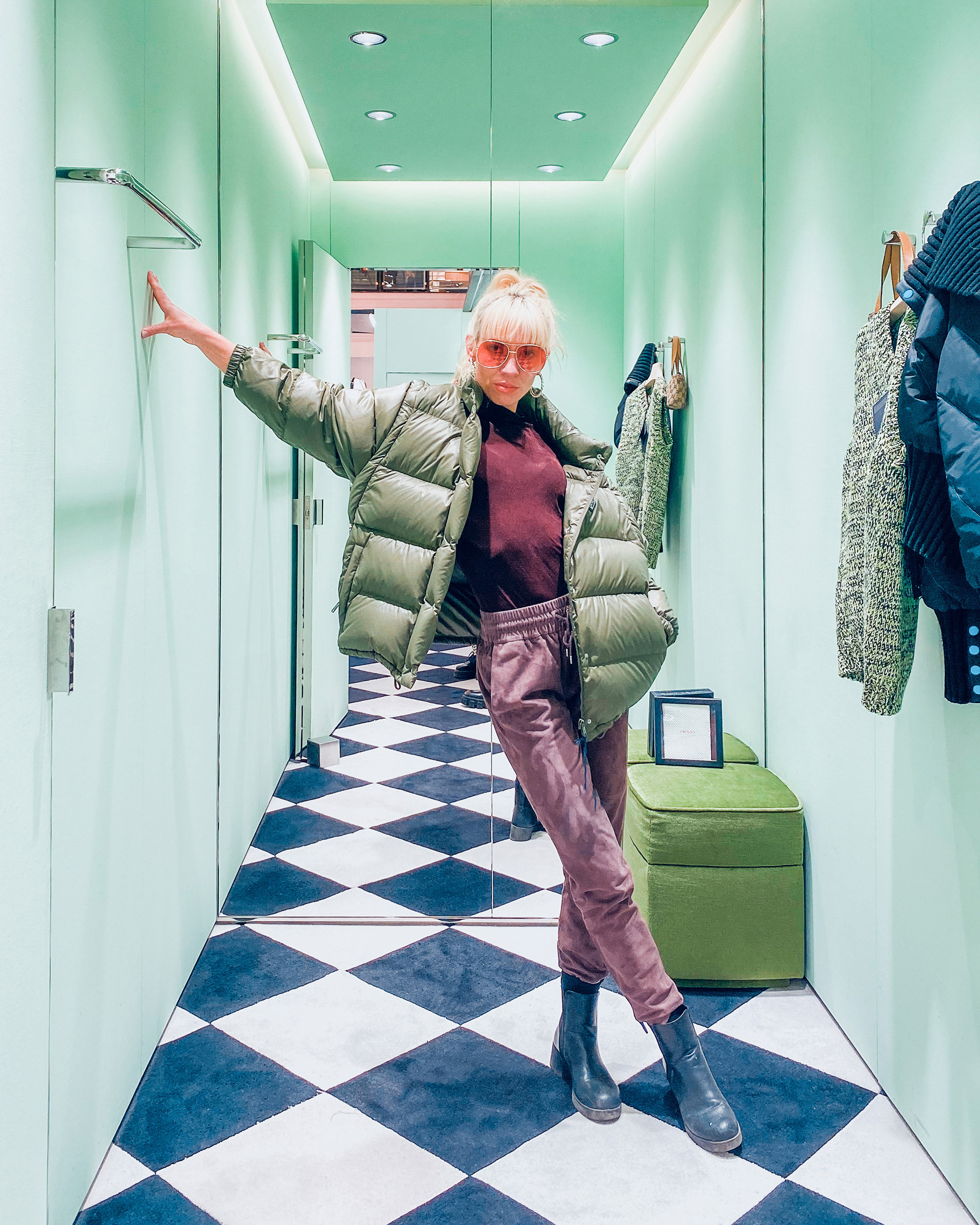 Actress showing off her outfit in a luxurious fitting room