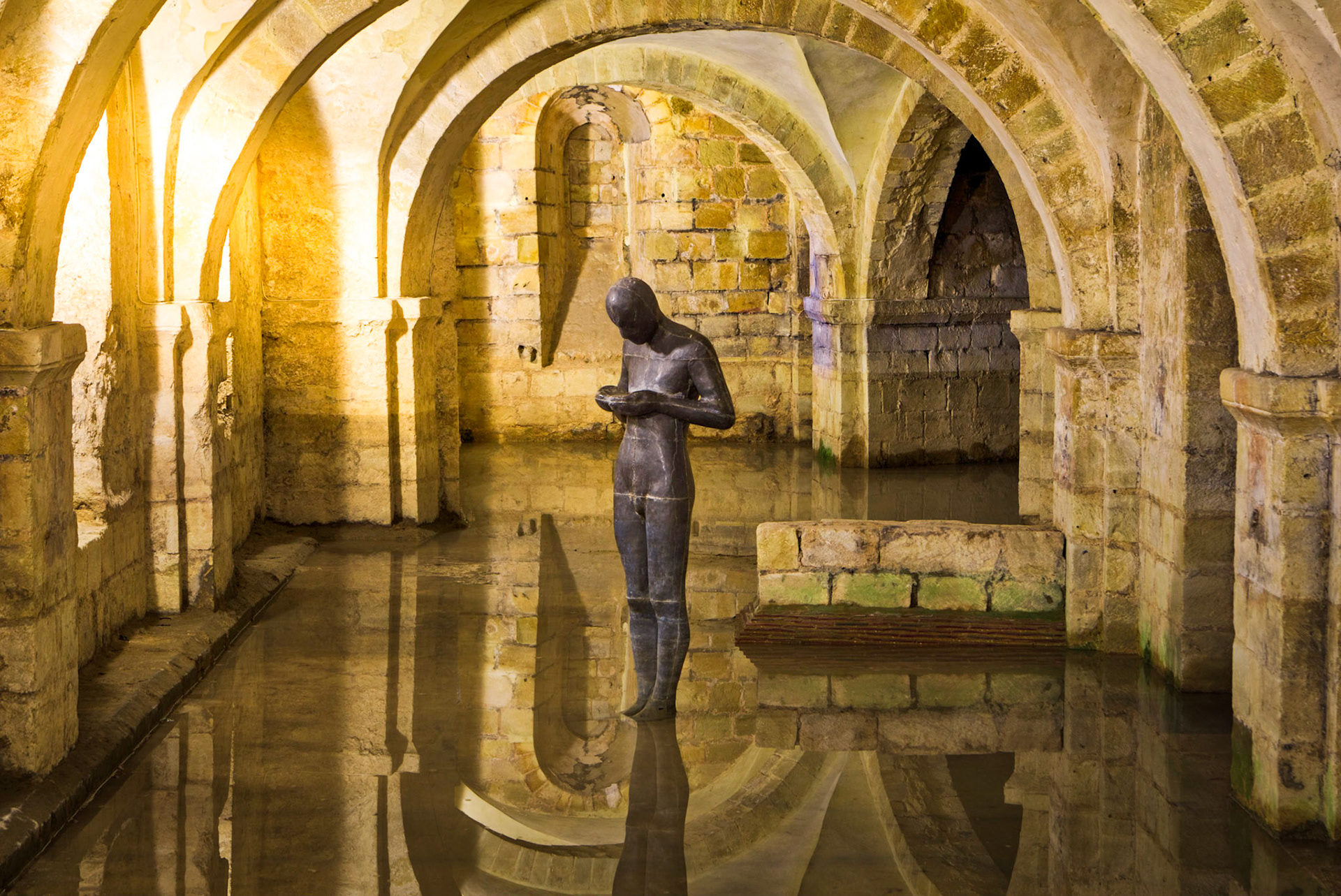 Sir Antony Gormley's “Sound II” Sculpture in the Flooded Crypt below Winchester Cathedral, Hampshire, UK (HA043)