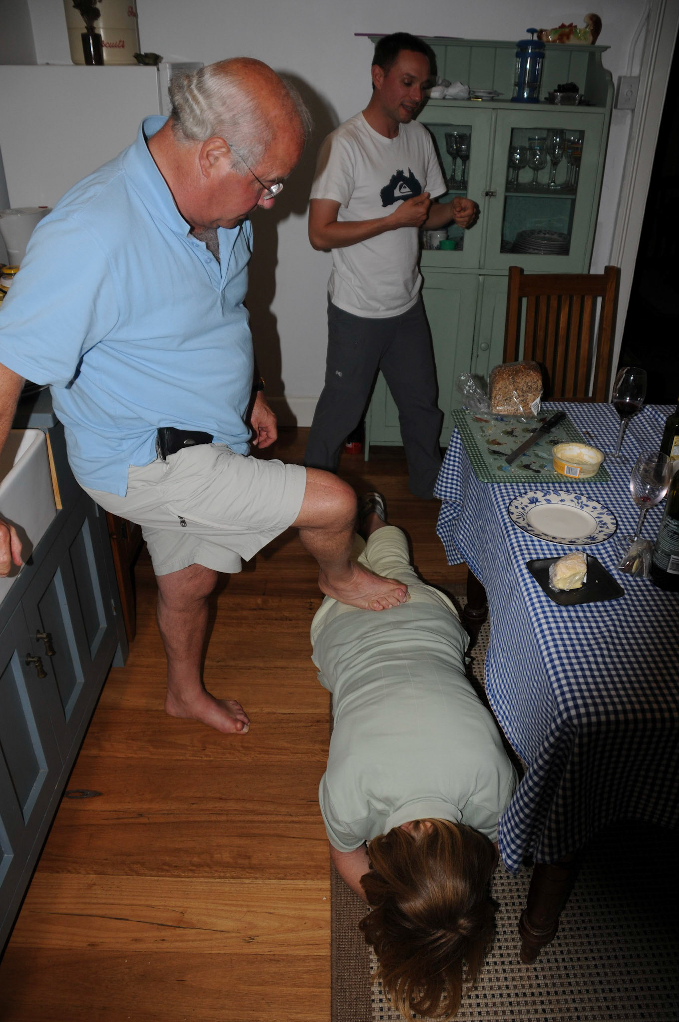 Mother doing the plank. Father being a plank.