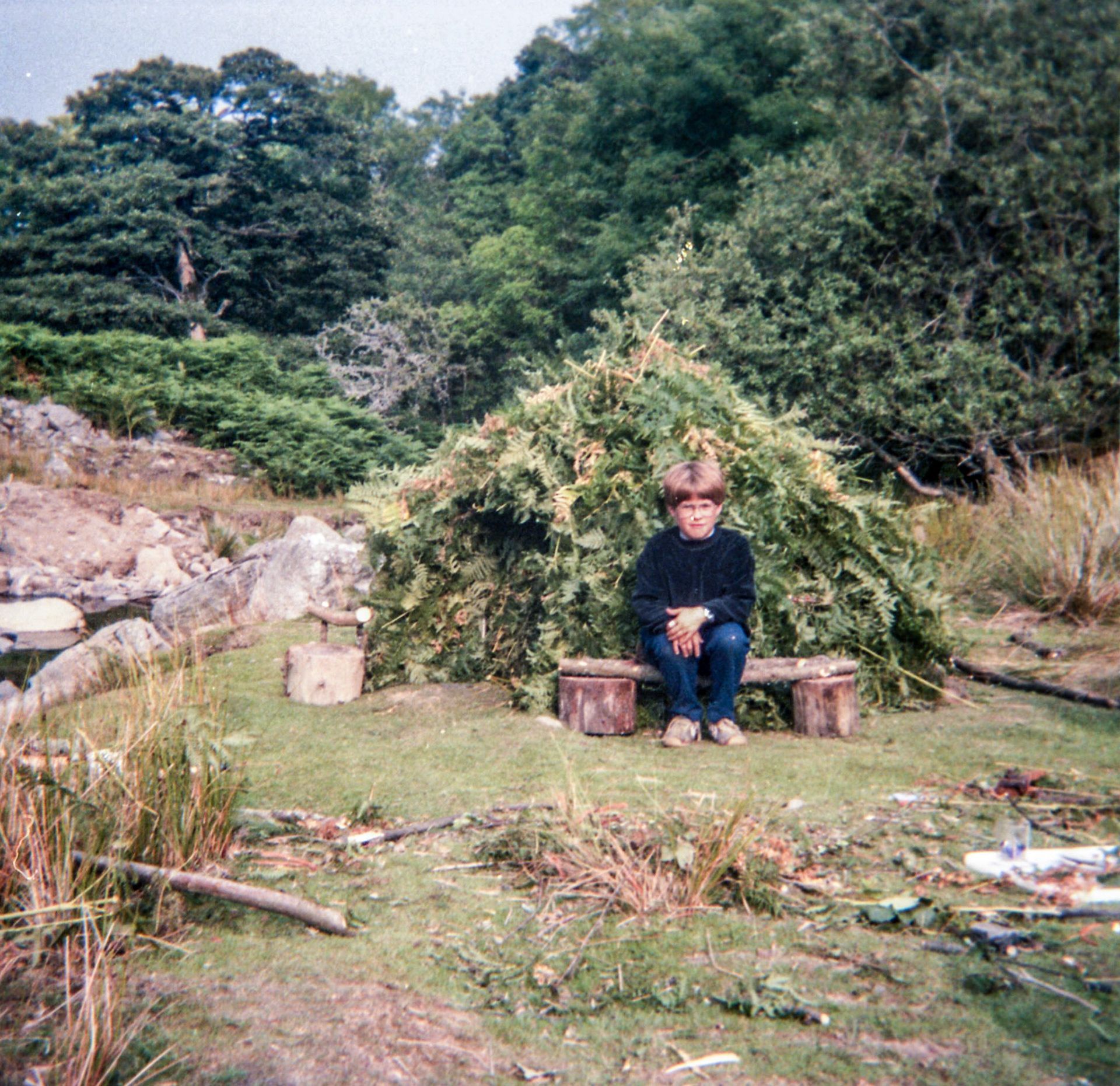 Me outside a hut we built in Wales