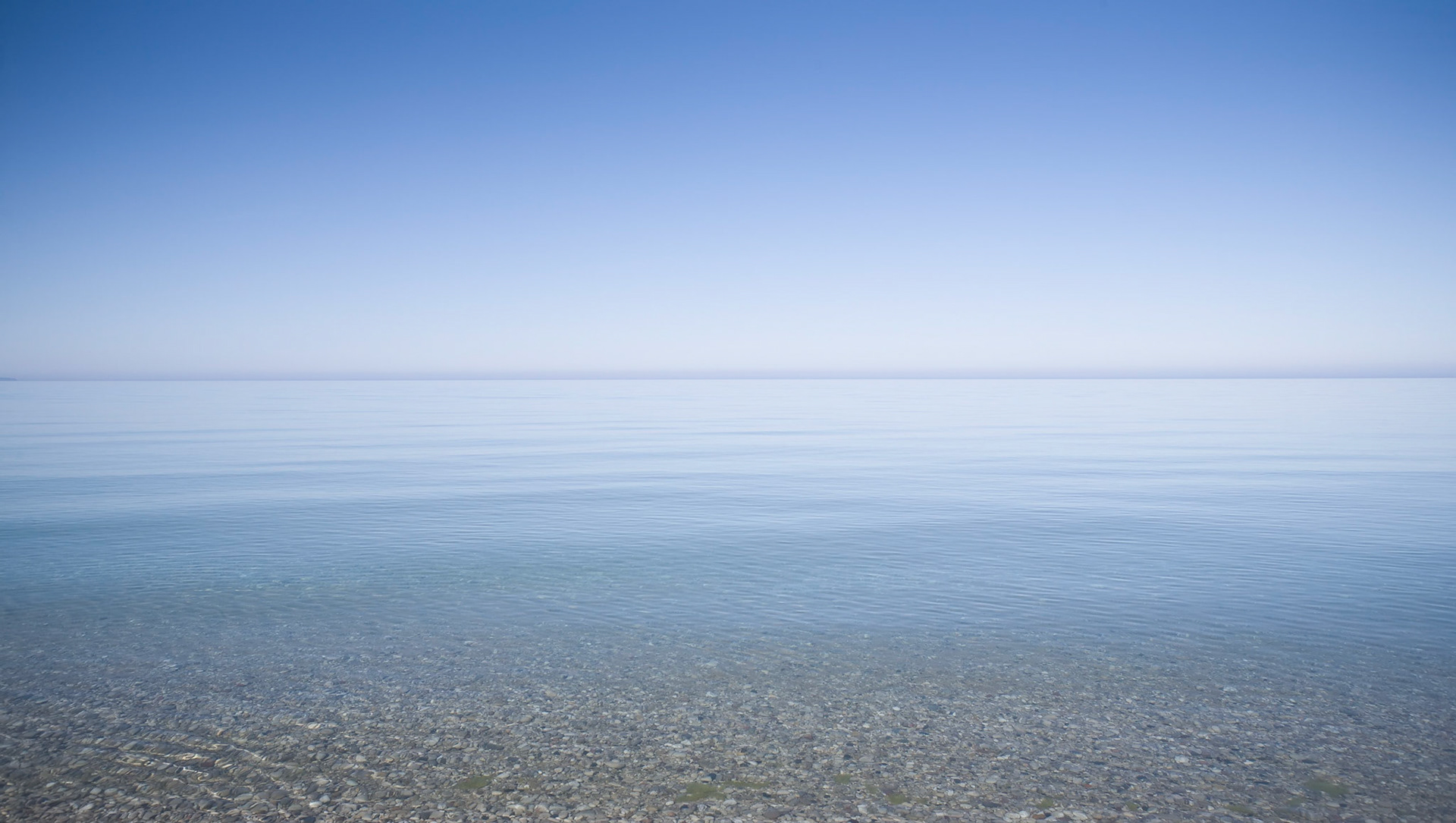 The Lake at Rest, Lake Michigan at North Bar Lake, 2010. Full Gallery Edition: 26"H x 40"W; Main Editions, various: 18"H x 24"W; 20"H x 29"W; 19"H x 28"W. Framed.