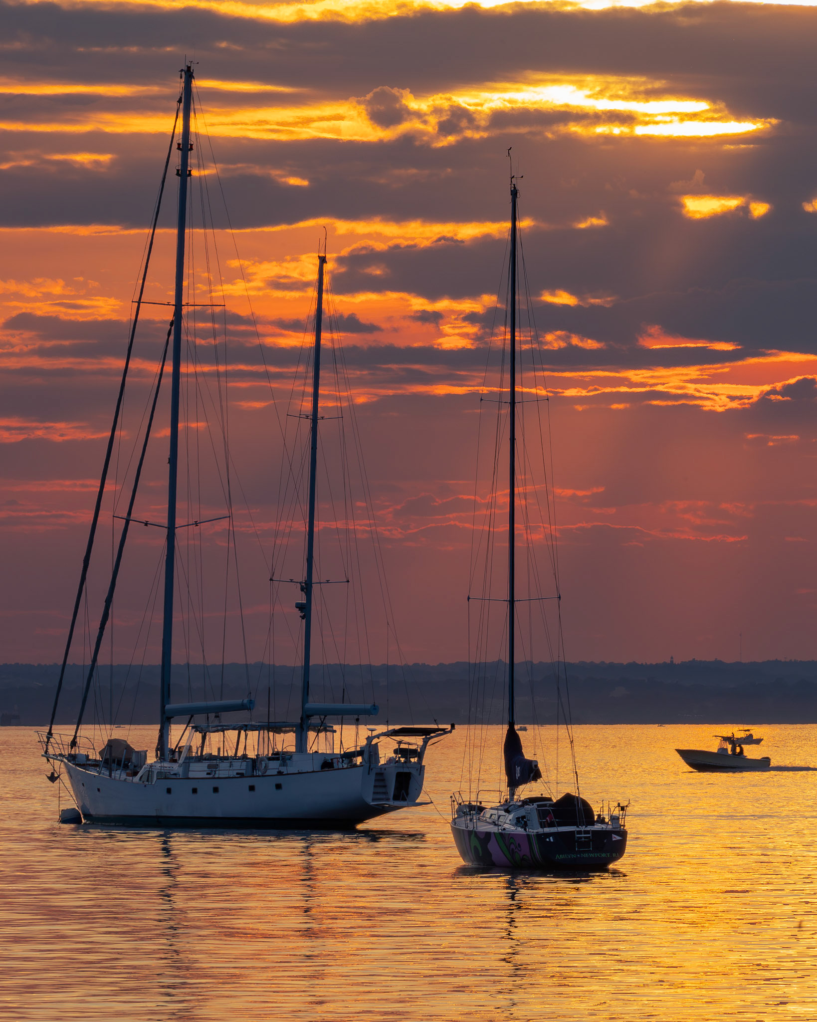 sailboats at sunset