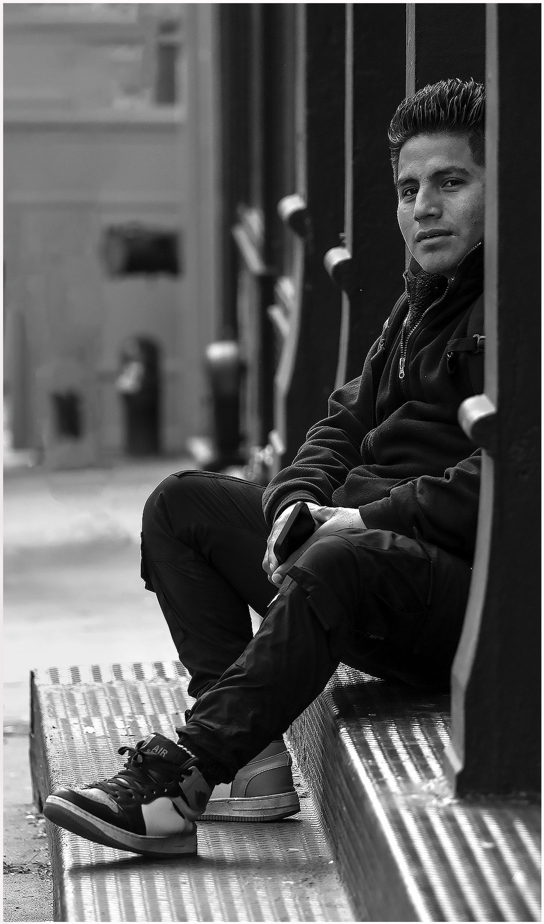 man waiting on the steps