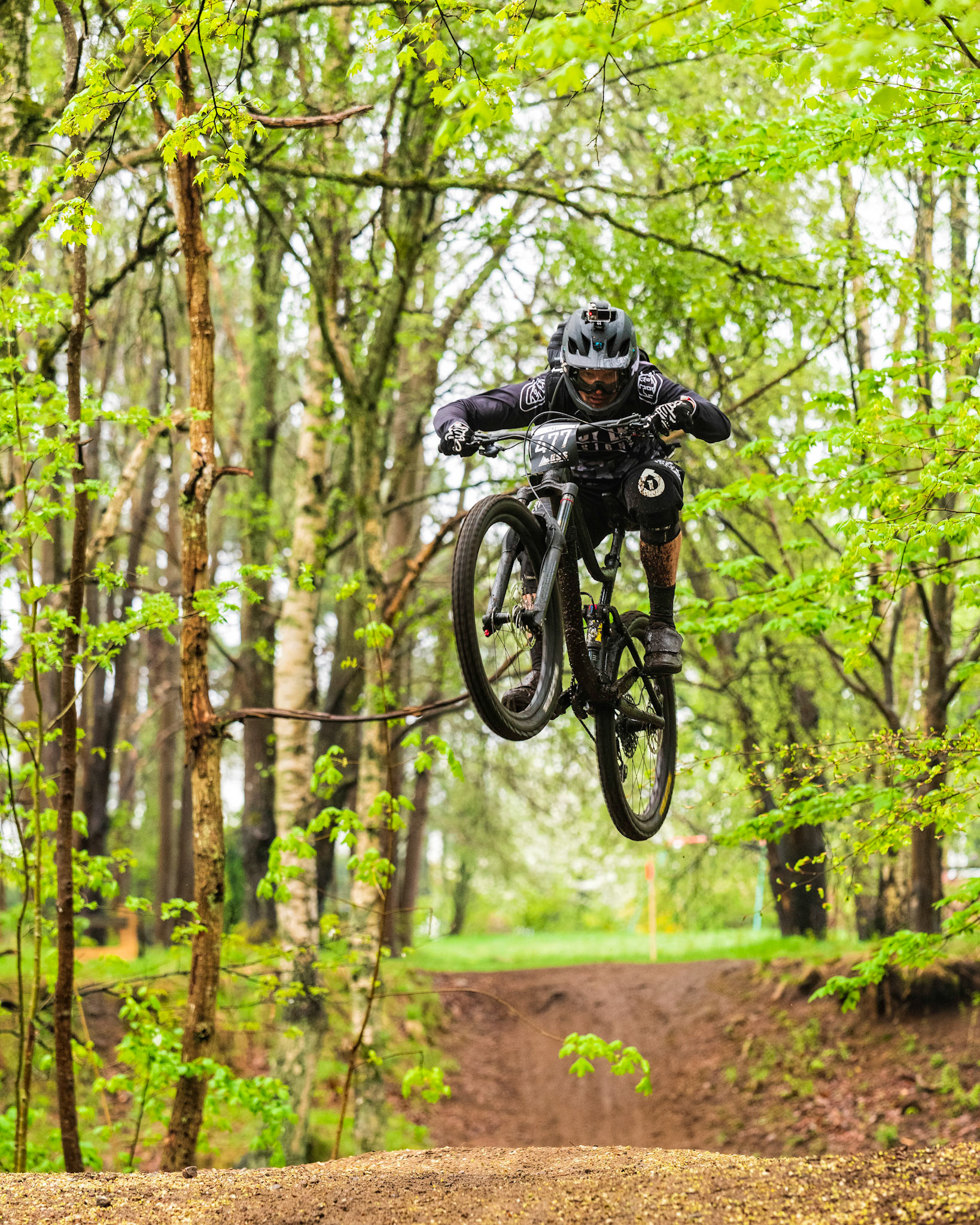 Mountainbike rider jumping at  ESS #1 (Enduro Sweden Series). Lackarebäck, Mölndal, Sweden.
