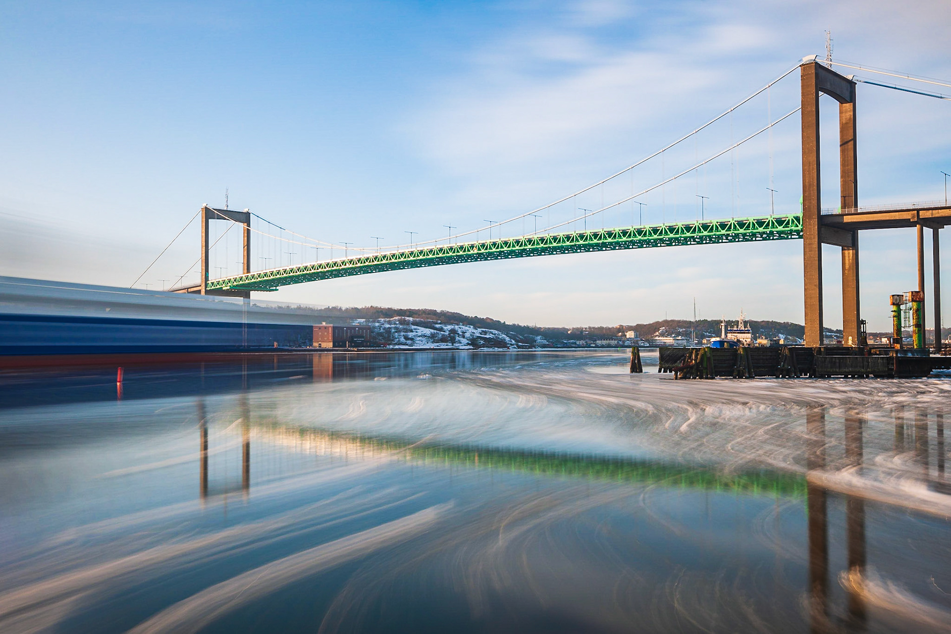 Ship are moving against Älvsborgsbron bridge.