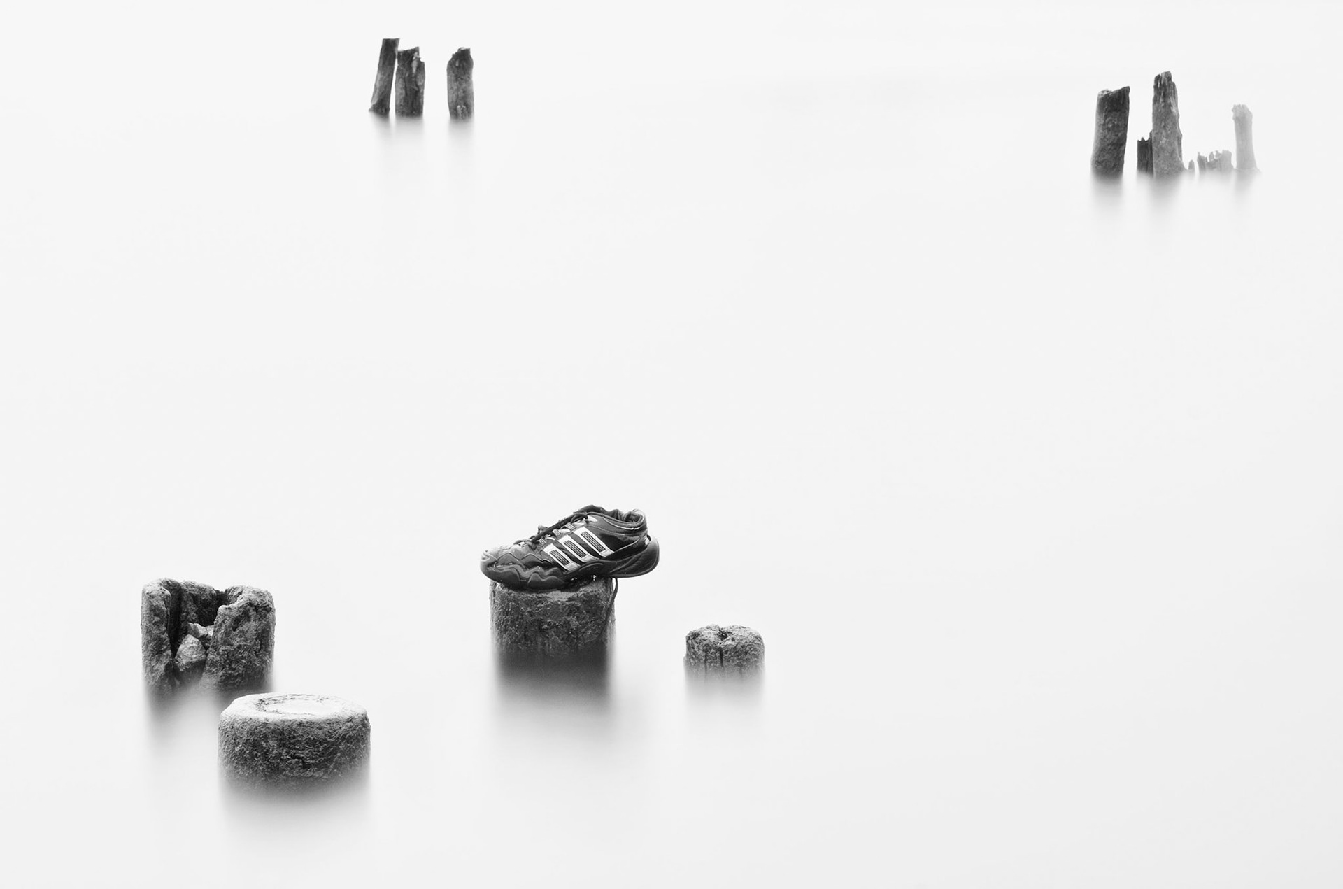 Training shoe and rocks on river, Göta Älv, Gothenburg, Sweden, Europe