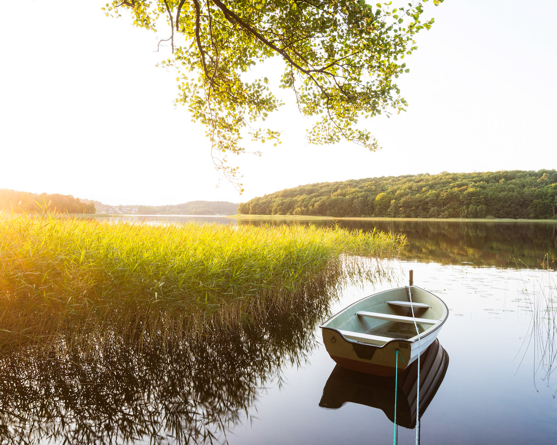 Moored boat reflection on lake