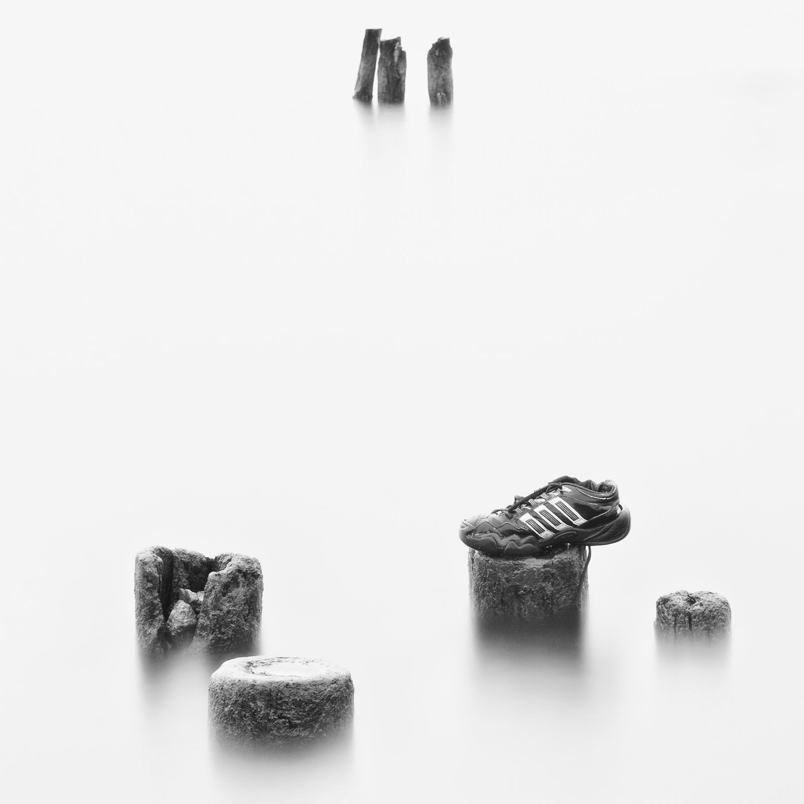 Training shoe and rocks on river, Göta Älv, Gothenburg, Sweden, Europe