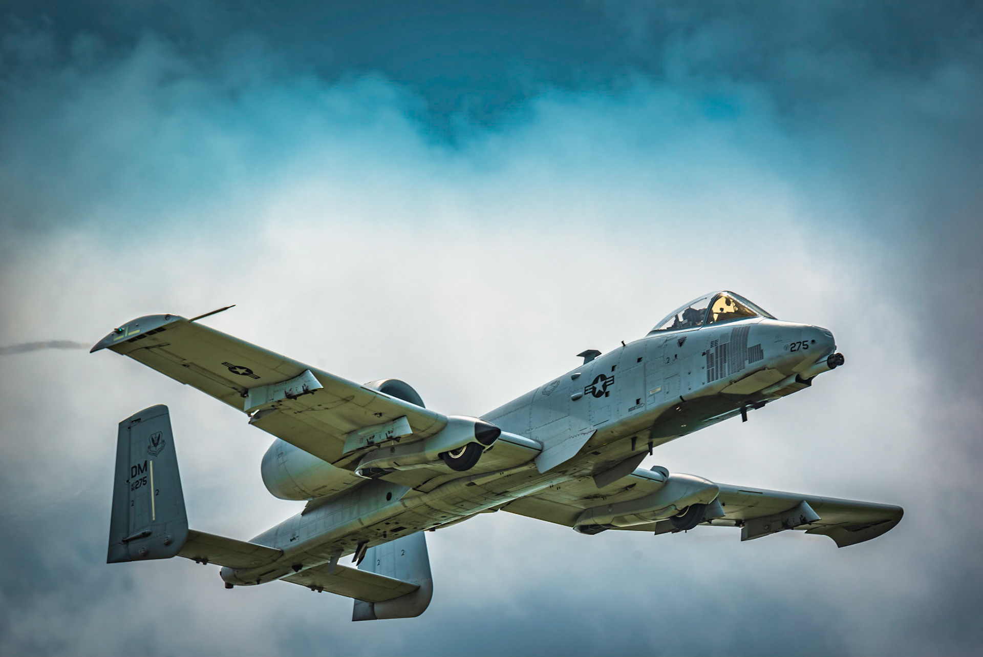 An A-10 Warthog flies through the air at an air show.