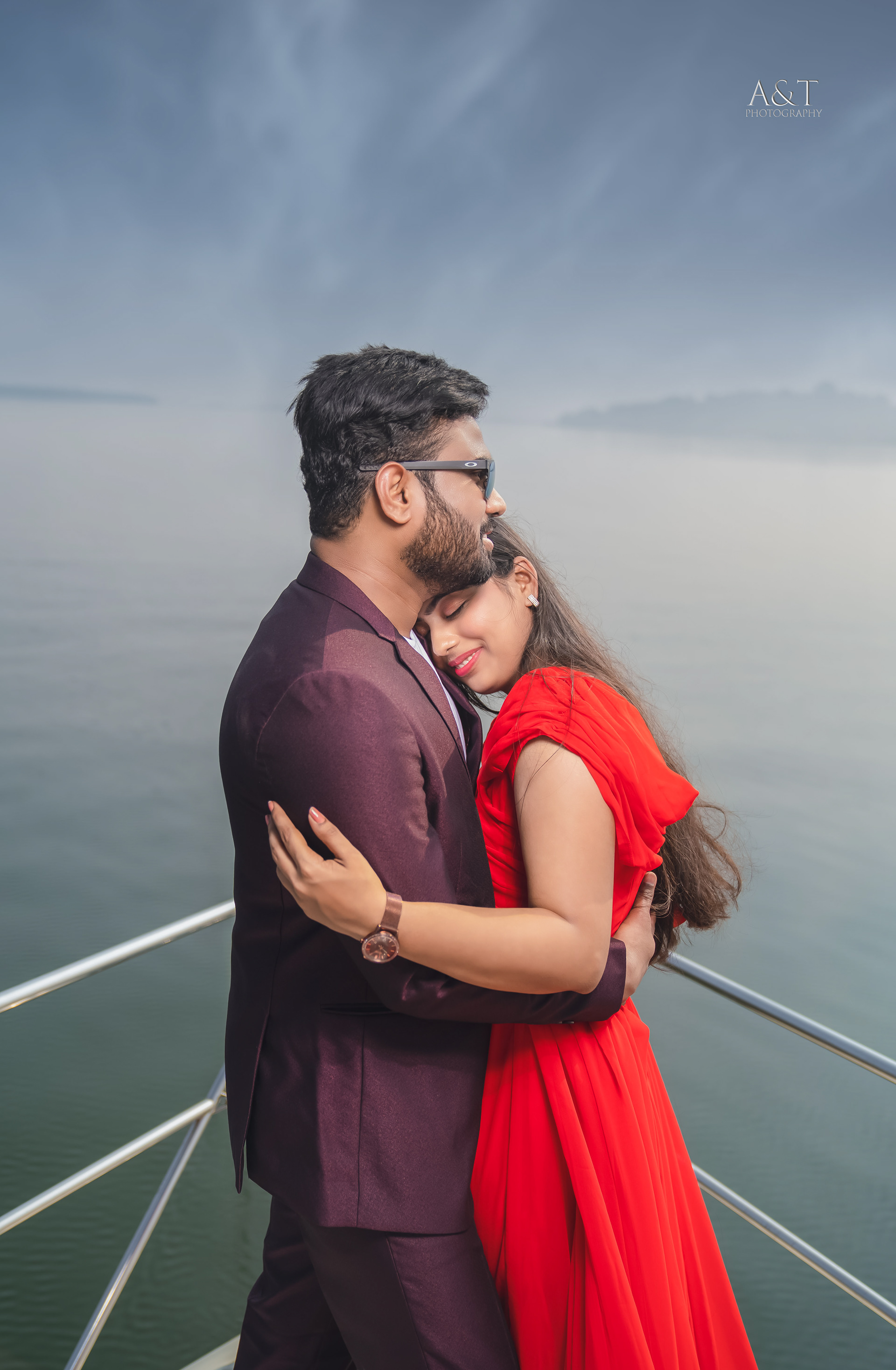 A yacht sailing on the ocean, symbolizing a journey of love. Beautiful capture by A&T Photography