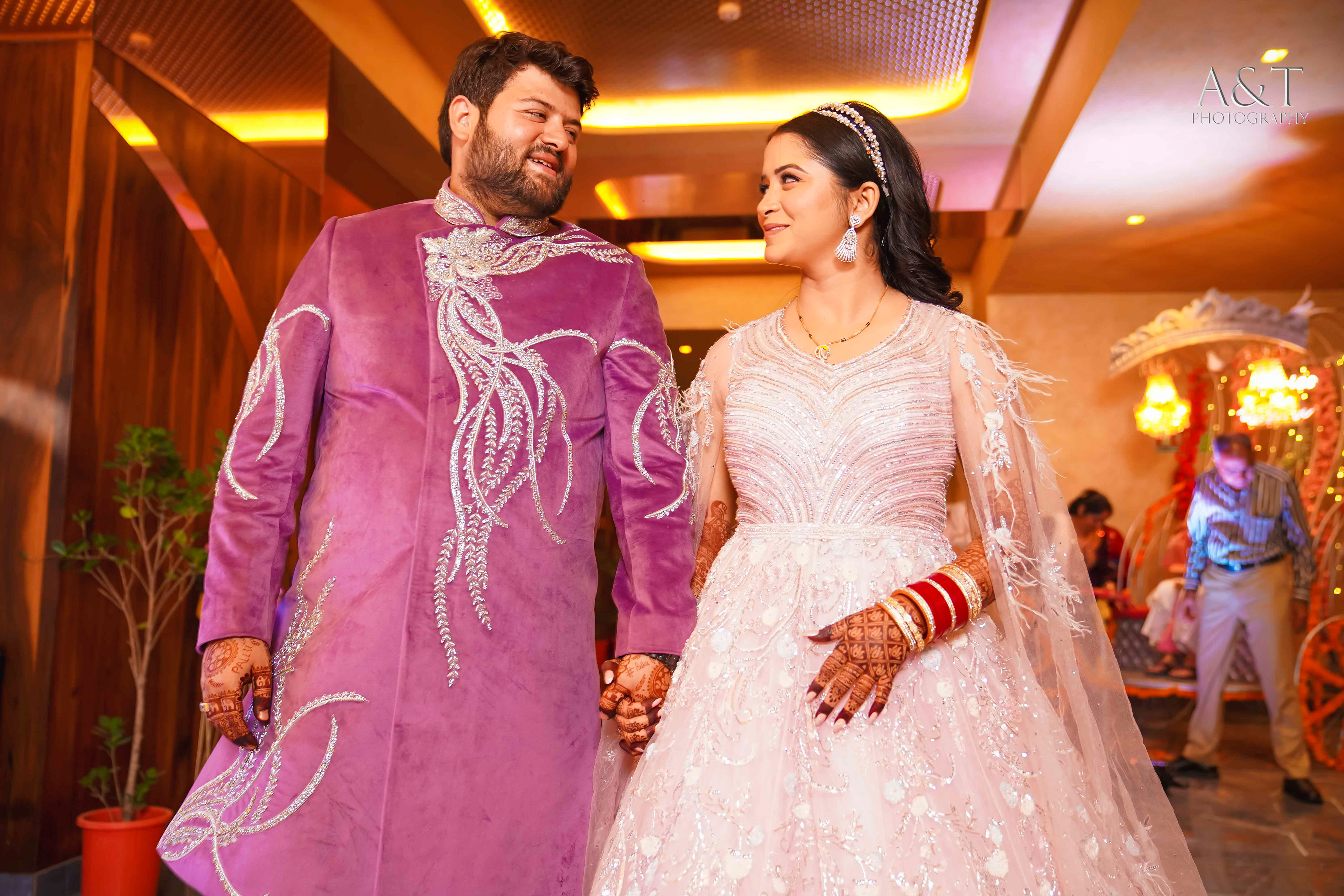 Bride and groom walking down the aisle, hand in hand, surrounded by loved ones at Destination Wedding