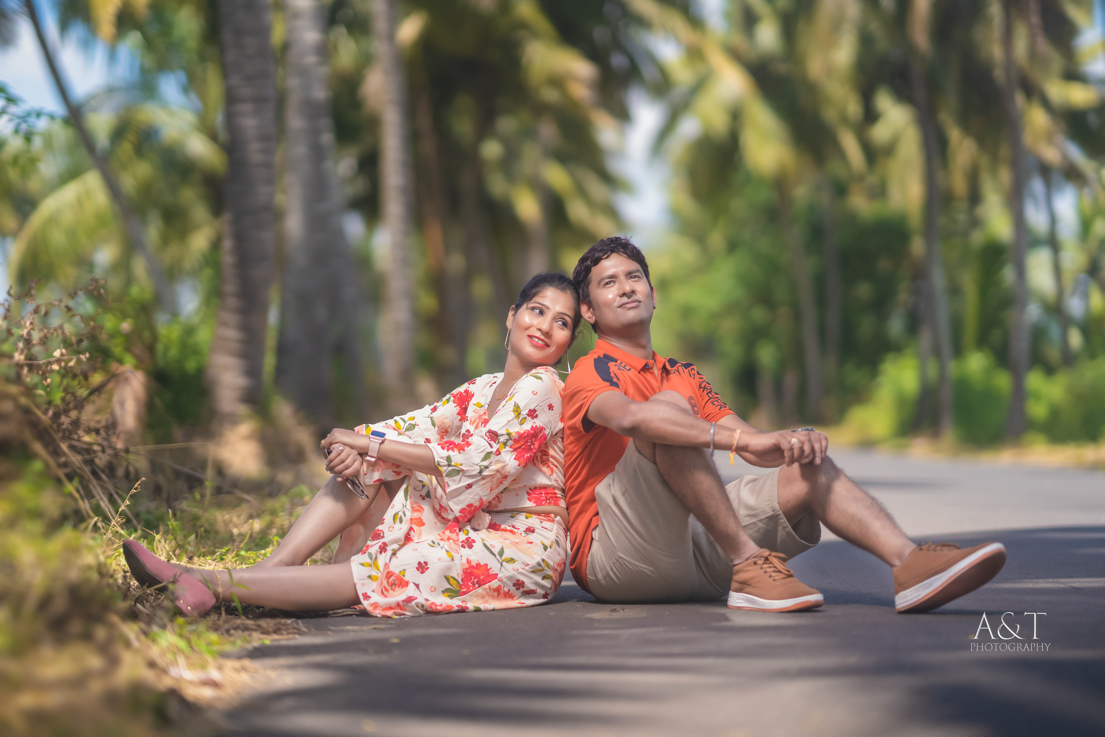 Sanket and Komal posing amidst lush greenery on winding roads during their pre-wedding shoot in Goa.