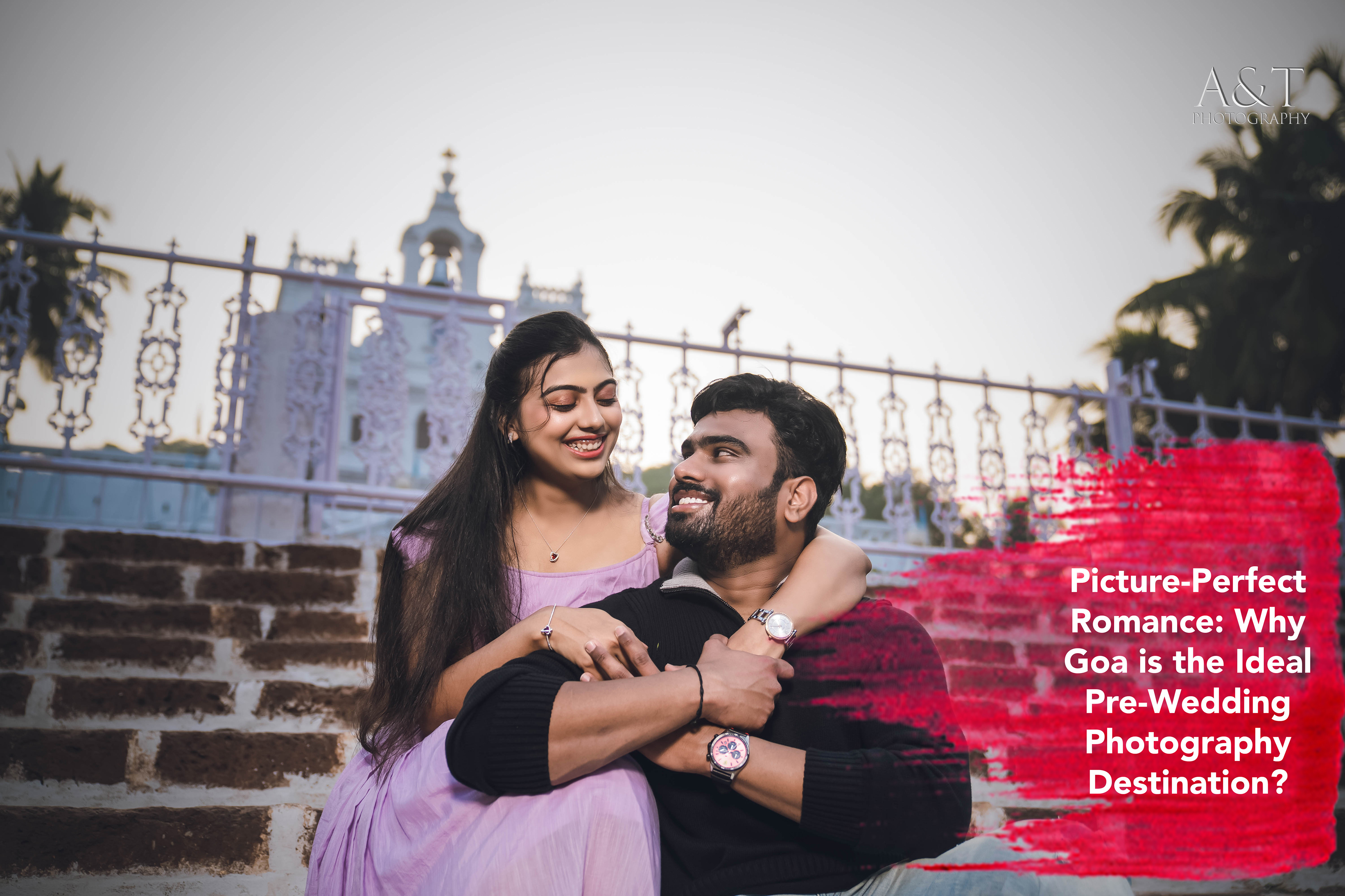 A couple poses lovingly in front of a centuries-old church in Old Goa. captured by A&T Photography