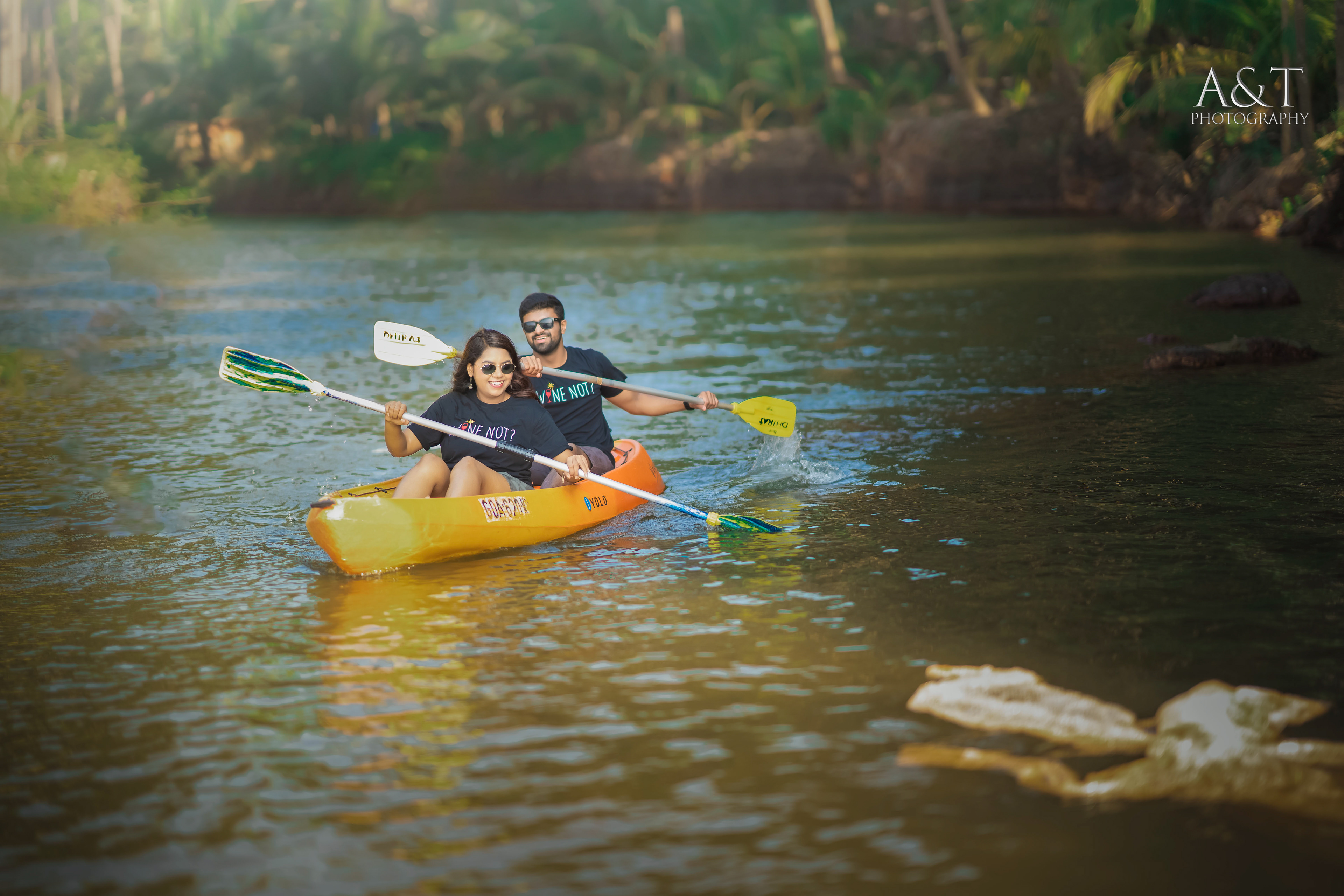 Joyful couple sharing a laughter-filled moment in the scenic beauty of Goa. Image is captured by Photographer in Goa