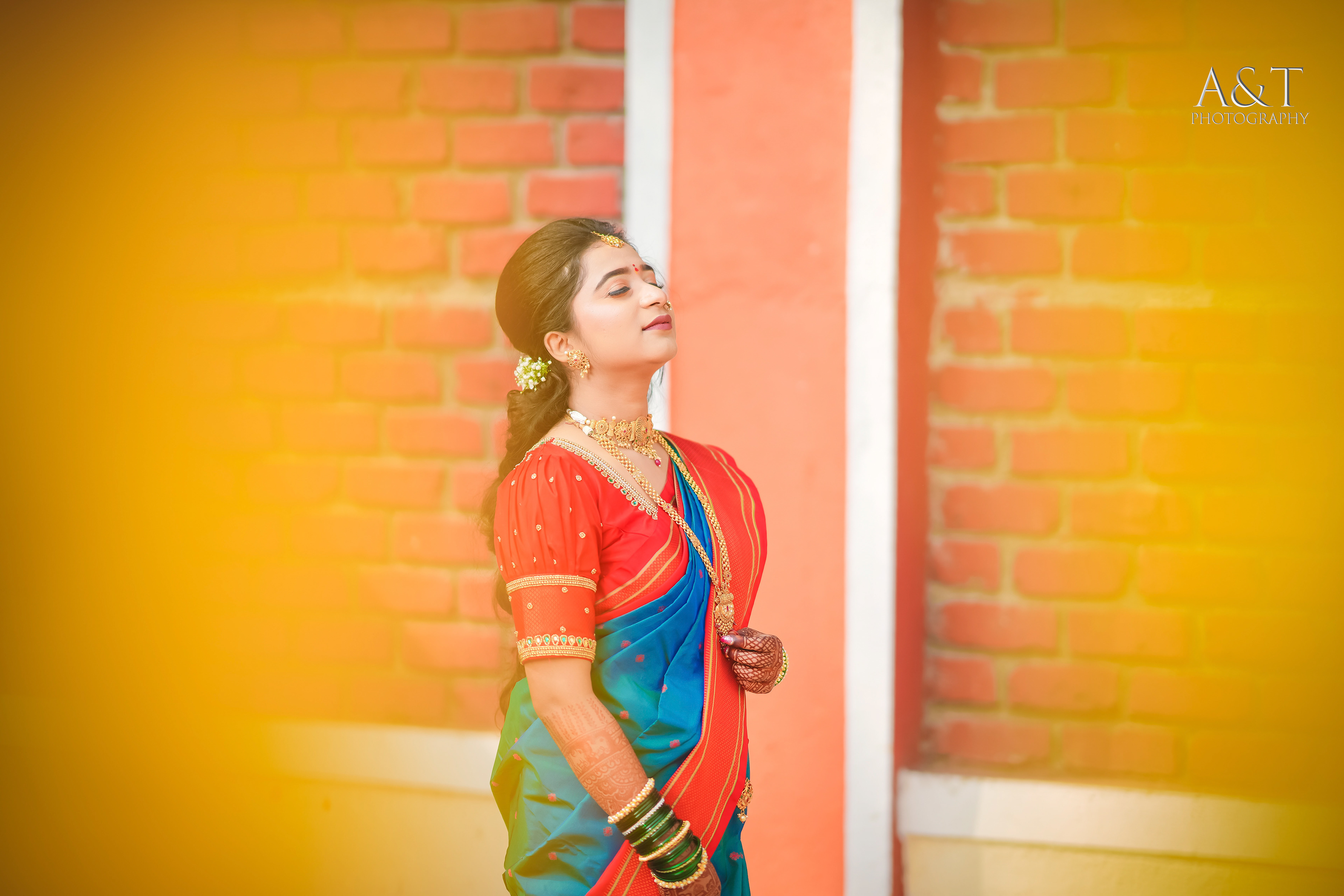 Elegant Maharashtrian bride donning a magnificent blue silk saree, a symbol of grace and tradition| A&T Photography- Top Wedding Photographer in Pune and Mumbai