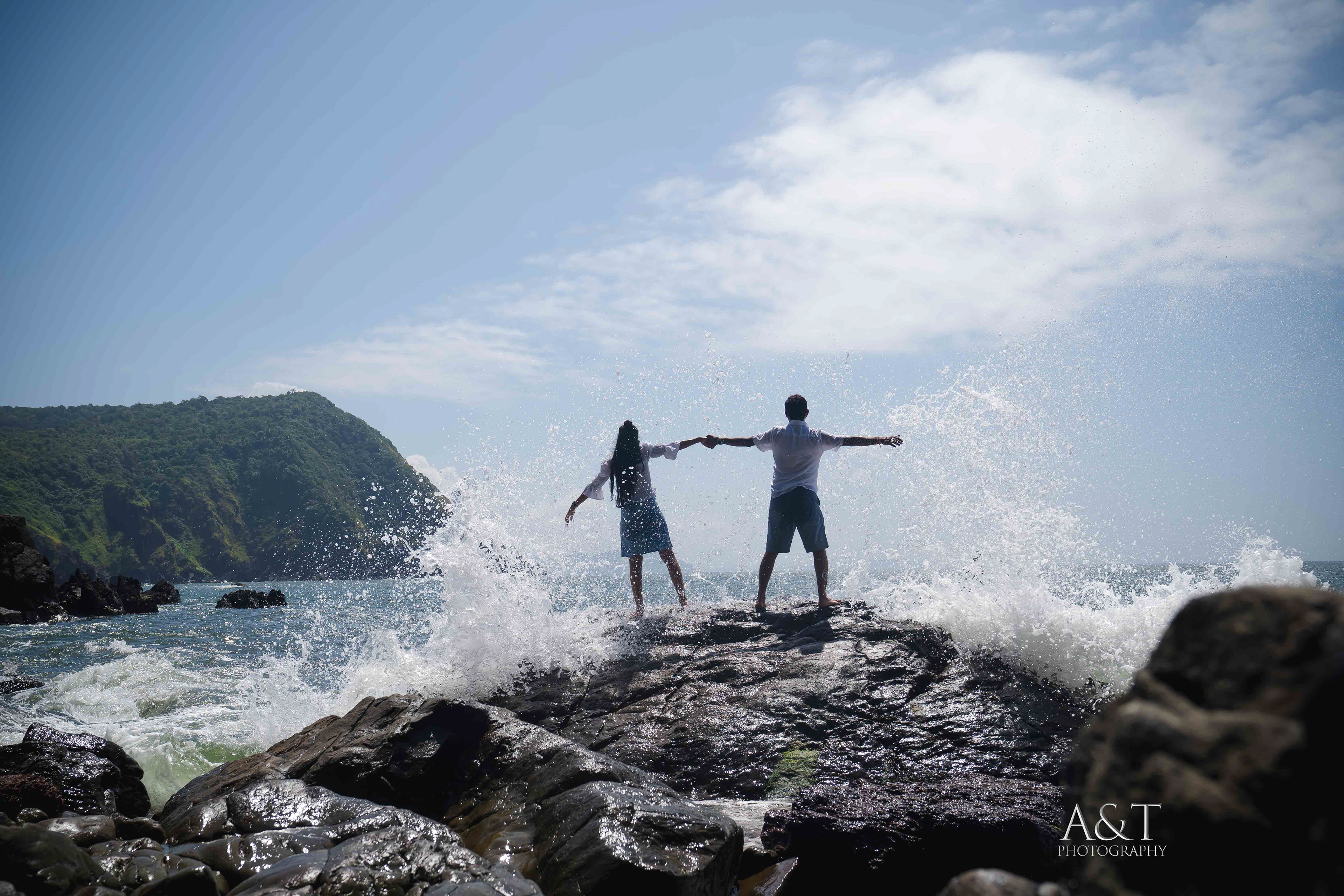 Water splashing on Sanket & Komal at their pre-wedding in Goa. This creative shot is captured by A&T Photography