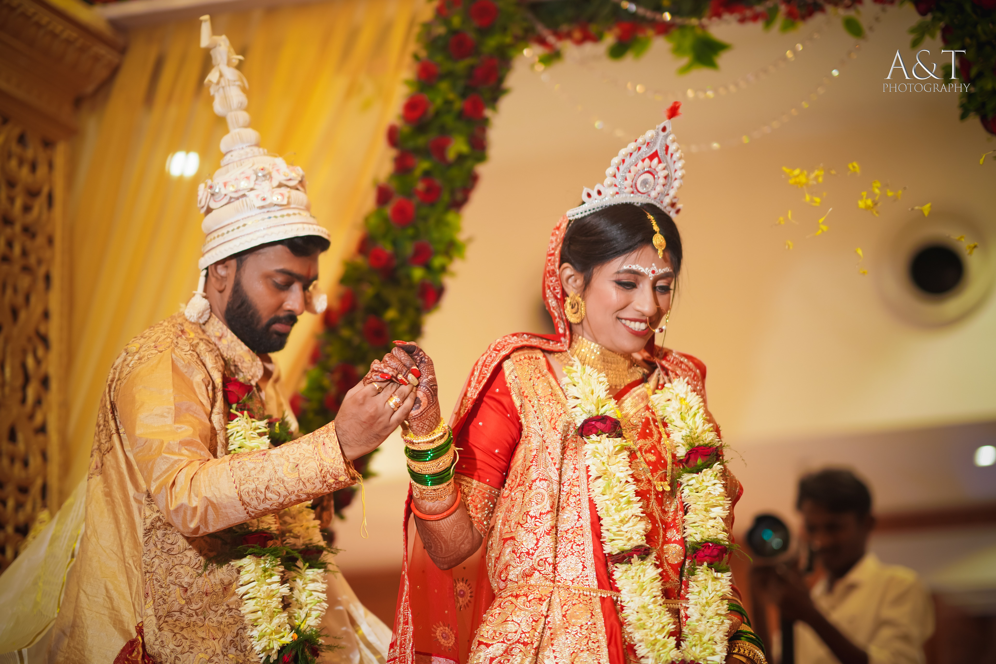 A candid moment captured during the wedding ceremony by A&T Photography
