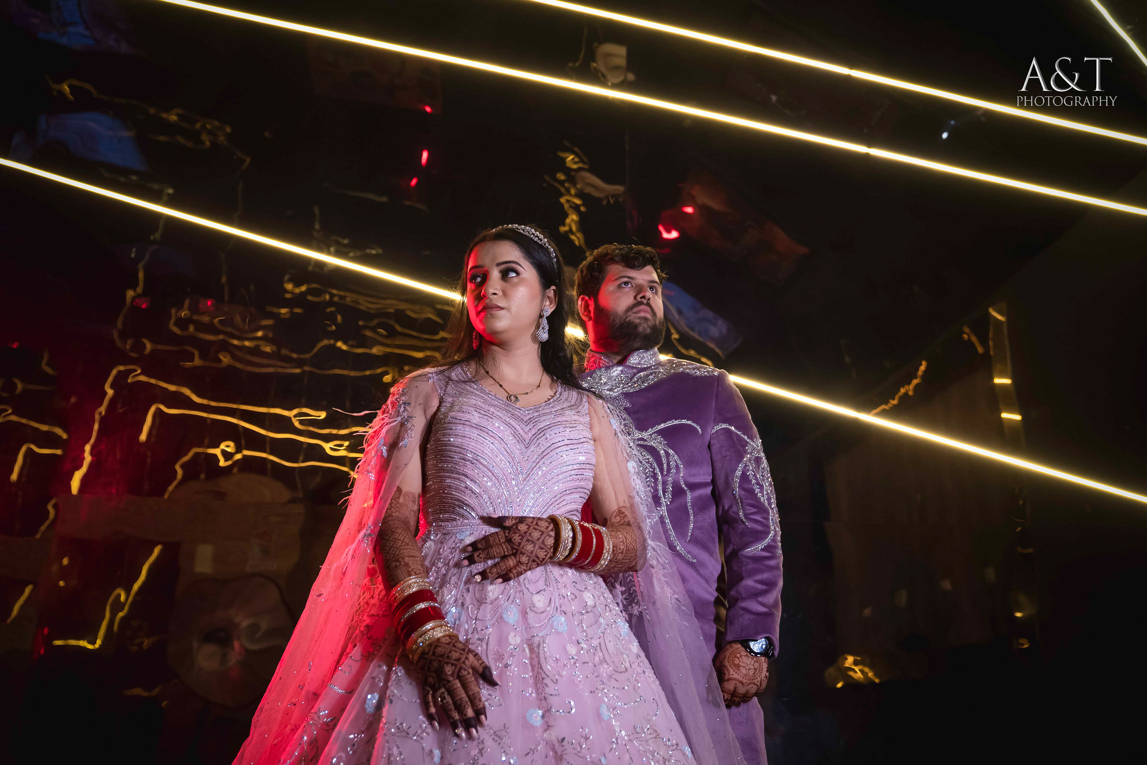Elegant bride and groom posing gracefully in a grand ballroom for their Destination Wedding in Mahabaleshwar