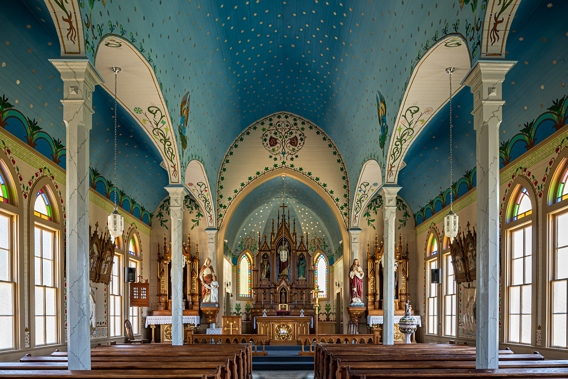 There are four so-called painted churches in the vicinity of Schulenberg, Texas. This particular church, Saints Cyril and Methodiious Catholic Church, is in the more or less ghost town of Dubina. The present church dates to 1911, though the interior is a recreation of the original interior that was for some mysterious reason painted over. I particularly love the stars on the ceiling in this church.I used a tilt-shift lens to keep the columns vertical while showing as much of the ceiling as possible.Date: 24 July 2019Location: Dubina, Texas, United StatesOriginal resolution: 36 MPProcessing: Processed from RAW using Adobe Photoshop Lightroom Classic 8