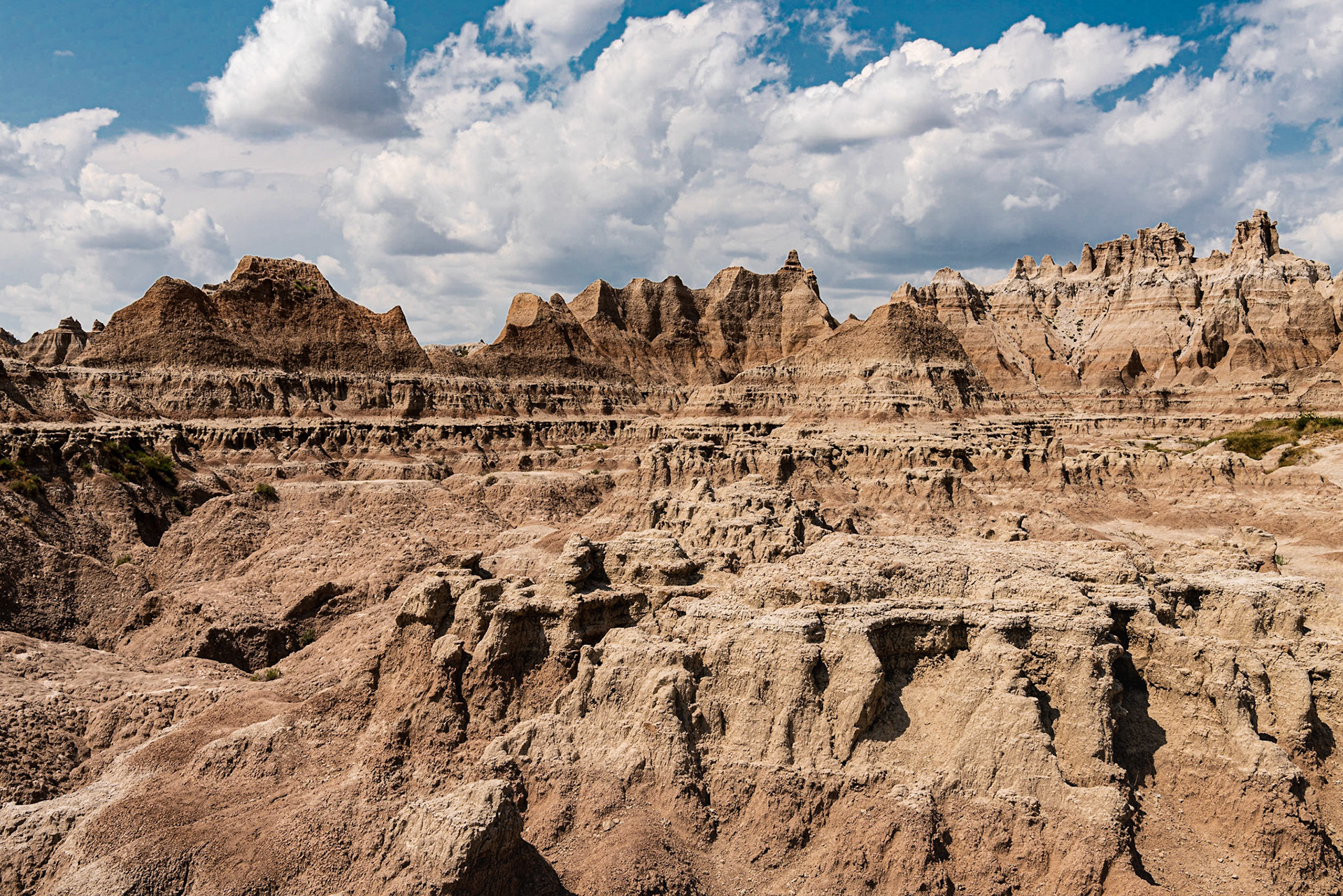 This photo of the badlands terrain at Norbeck Pass in Badlands National Park had a surprising range of contast given that it was photographed well into the day.  I used a polarizing filter to increase the contrast.Date: 6 August 2018Location: Badlands National Park, South Dakota, United StatesOriginal resolution: 36 MPProcessing: Processed from RAW using Adobe Photoshop Lightroom 6