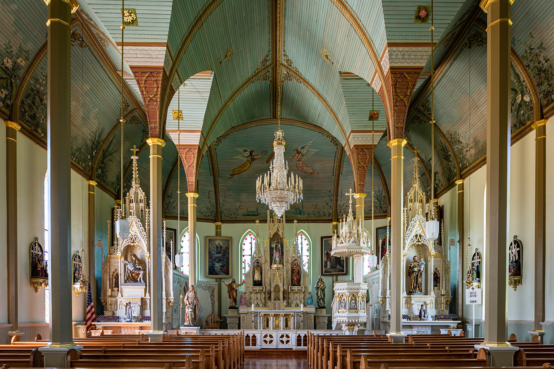 St. Mary's Church of the Assumption sits in the village of Praha (Czech for Prague). I used a tilt-shift lens to keep the columns vertical. The vaulted celings are unique among the painted churches.Date: 24 July 2019Location: Praha, Texas, United StatesOriginal resolution: 36 MPProcessing: Processed from RAW using Adobe Photoshop Lightroom C;lassic 8