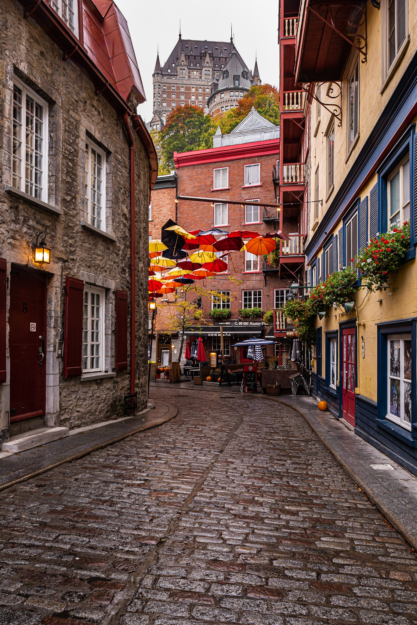 Rue du Cul de Sac is a famous pedestrian street in the lower town of Vieux Québec, noted for its color, architectural detail, and view of the Fairmont le Château Frontenac. We got up early to take this photo, before the tourist crowds started streaming in. I used a tilt-shift lens to keep the architectural lines vertical.Date: 7 October 2018Location: Québec, Québec, CanadaOriginal resolution: 36 MPProcessing: Processed from RAW using Adobe Photoshop Lightroom Classic CC 7