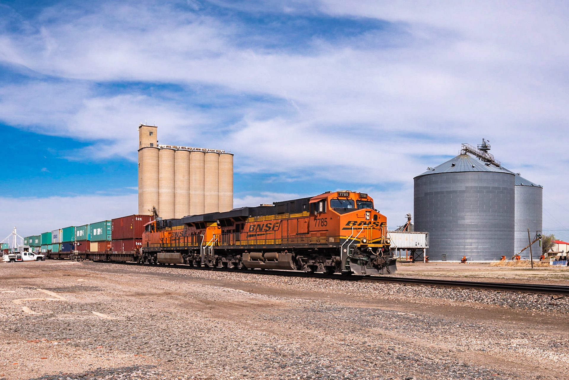 We were driving from Amarillo to Caprock Canyons State Park and nearing Claude when I spotted this intermodal consist waiting to pass on a siding. I decided to find a spot along the tracks in Claude to take a photo. It was moving pretty fast by the time it passed through town. I managed to capture a classic wedge shot in front of the grain silos.Date: 16 March 2017Location: Claude, Texas, United StatesOriginal resolution: 36 MPProcessing: Processed from RAW using Adobe Photoshop Lightroom Classic 9