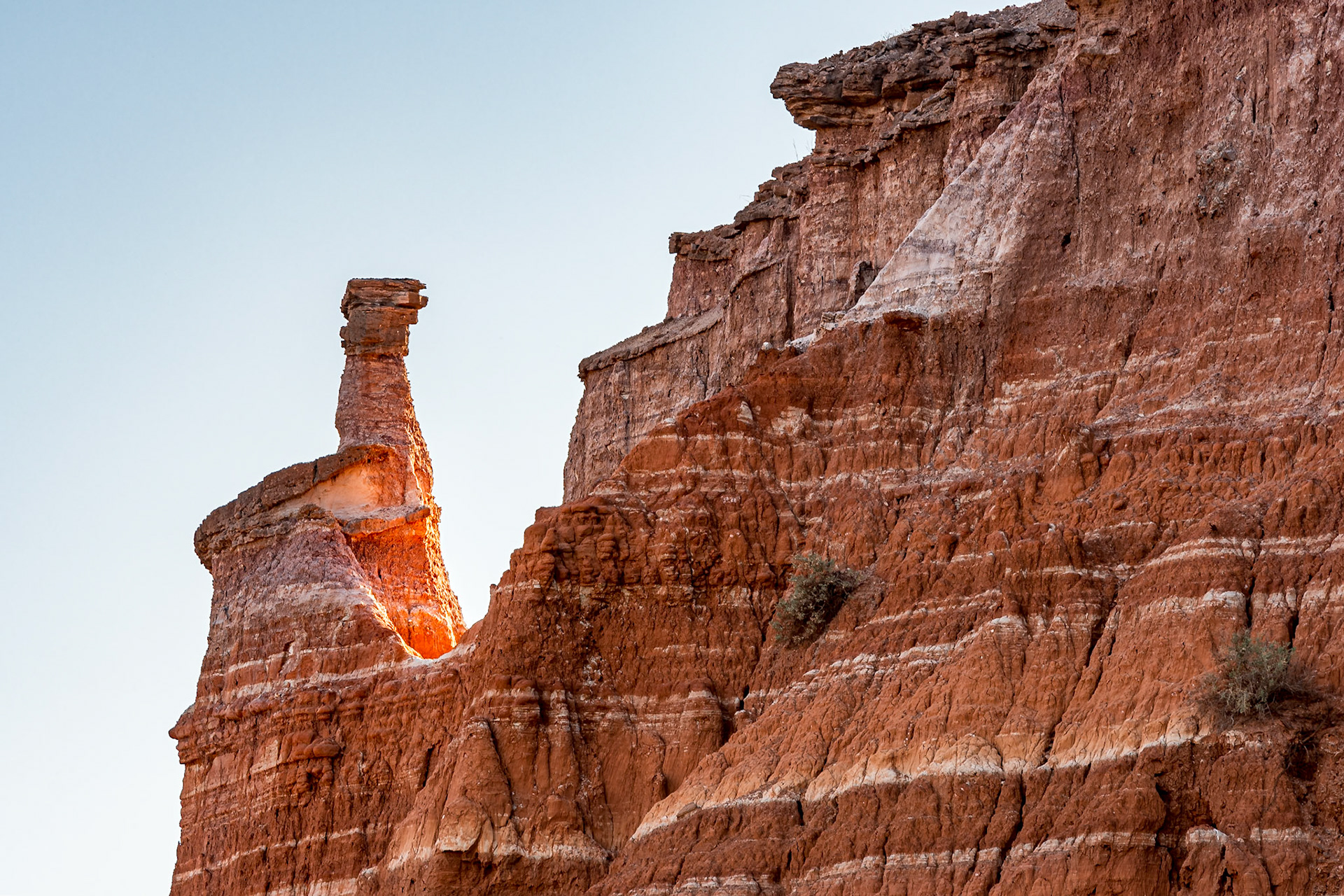 We were hiking back from the Lighthouse in Palo Duro Canyon when I spotted the sunlight highlighting the base of this hoodoo.Date: 15 March 2017Location: Palo Duro Canyon State Park, Texas, United StatesOriginal resolution: 20 MPProcessing: Processed from RAW using Adobe Photoshop Lightroom 6