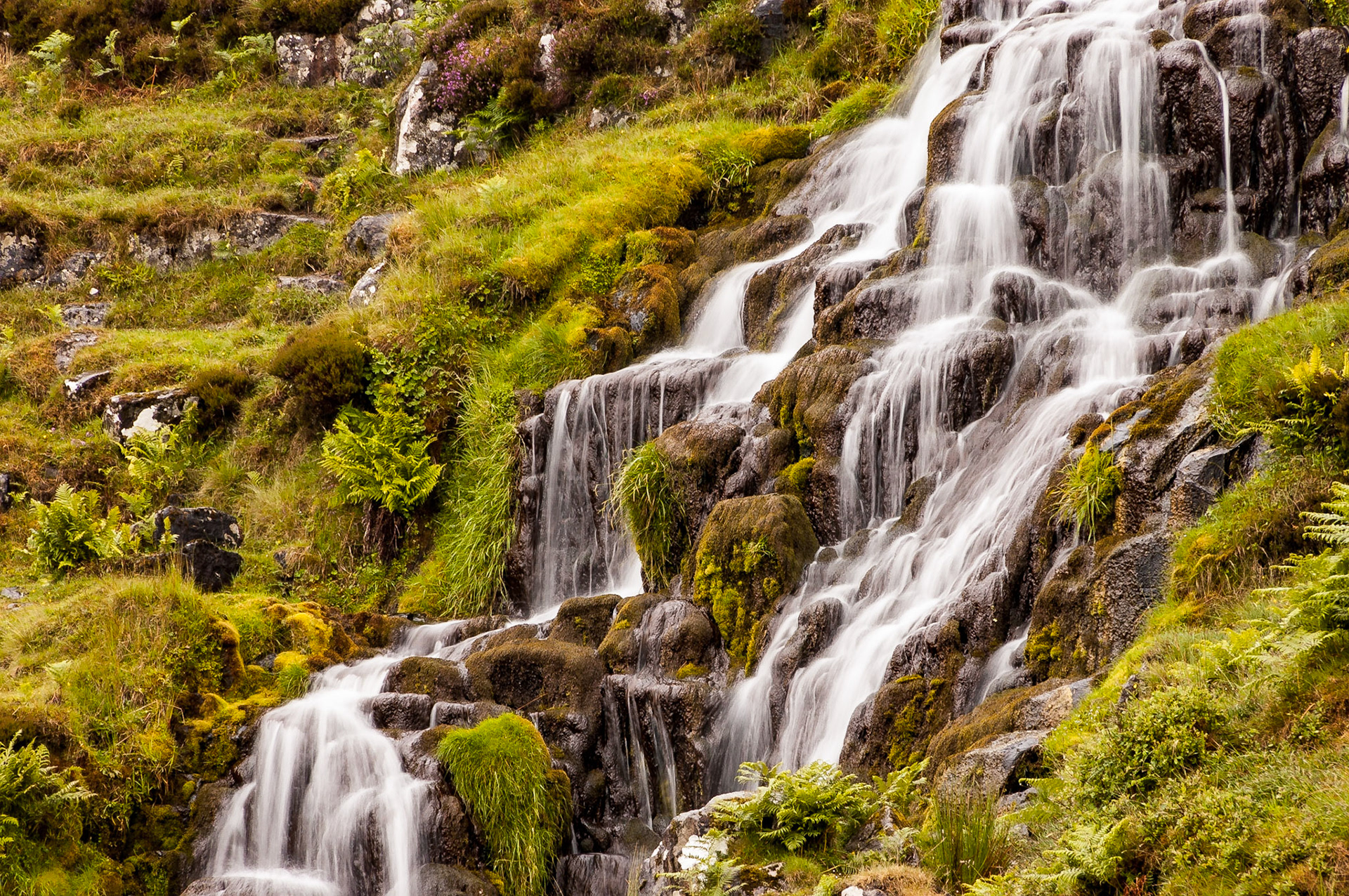 These small falls sit by the A855 on the Isle of Skye, north of Portree. They lie on a stream that leads to Loch Leathan on the opposite of the road.Date: 30 June 2007Location: Isle of Skye, Scotland, United KingdomOriginal resolution: 6 MPProcessing: Processed from RAW using Adobe Photoshop Lightroom 6
