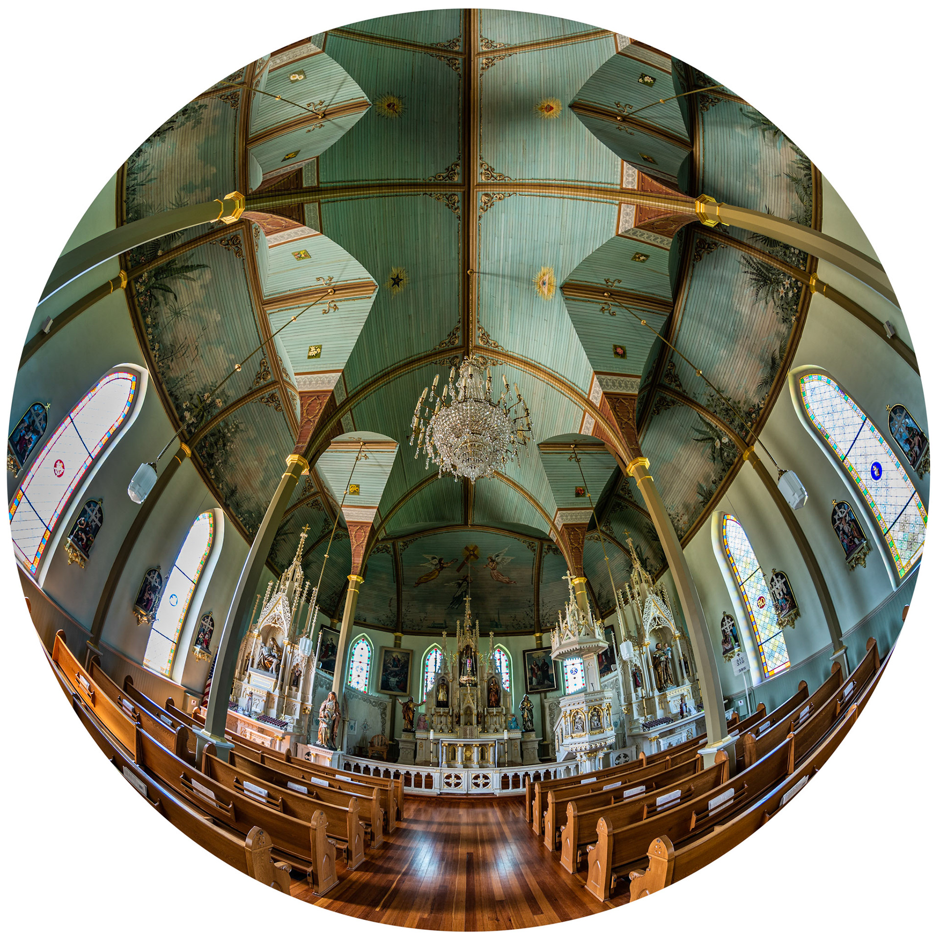 Saint Mary's Church of the Assumption is located in the village of Praha. It is one of the four painted churches of Fayette County.  I loved all of the angles and curves in the sanctuary and decided to use a fisheye lens to create a kaleidoscopic look. I made the beautiful chandelier near the front of the sancturary the focal point for the photo.  Date: 24 July 2019Location: Praha, Texas, United StatesOriginal resolution: 36 MPProcessing: Processed from RAW using Adobe Photoshop Lightroom Classic 8