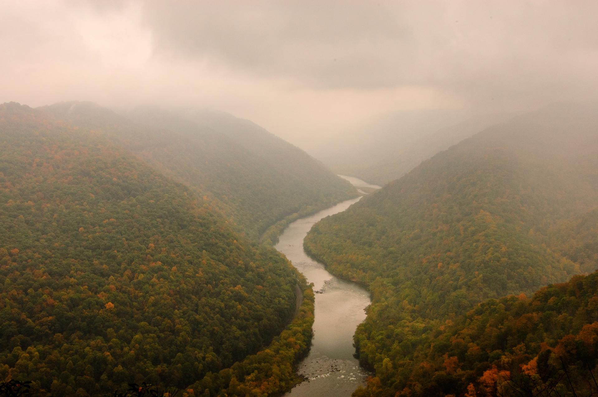On a misty fall day, the New River snakes north through its gorge south of the Grandview overlook.