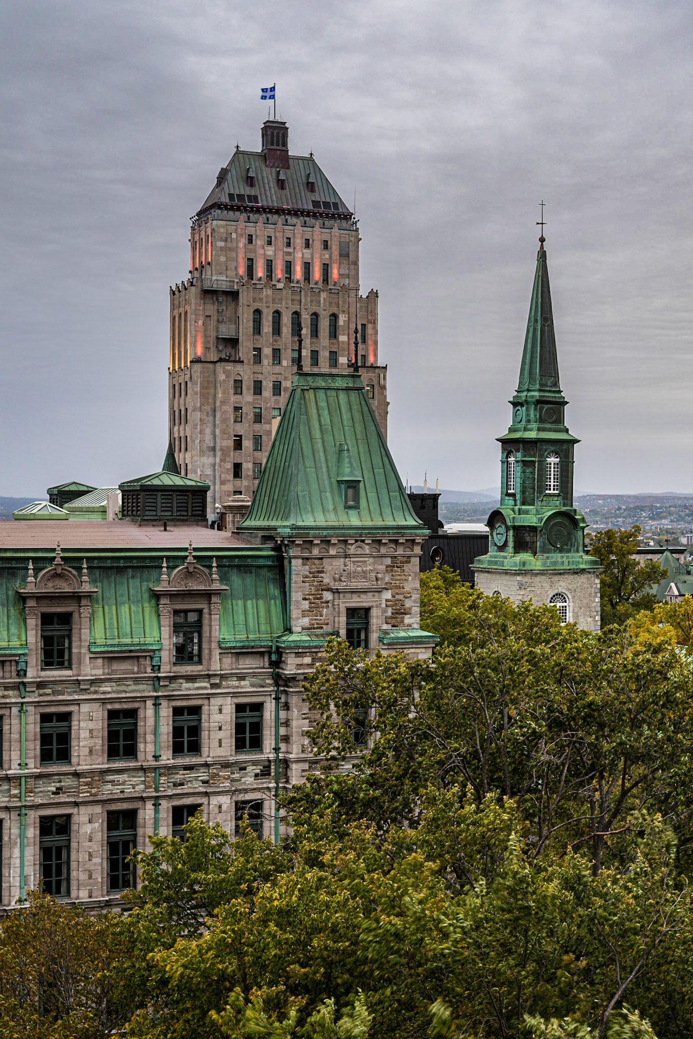 We had a beautful corner room on the sixth floor of the Fairmont le Château Frontenac that offered nice views of the surrounding old city. In this photo, I captured Édifice Gérard-D.-Levesque, which houses the Ministere des Finances du Québec (Ministry of Finance of Québec), Cathédrale de la Sainte-Trinité (Holy Trinity Cathedral), which was the first Anglican church built outside the British Isles, and Édifice Price (the Price Building), which is the official quarters of the Prémier of Québec. Dusk was just starting to fall on an overcast day, so the lighting is very even.Date: 6 October 2018Location: Québec, Québec, CanadaOriginal resolution: 36 MPProcessing: Processed from RAW using Adobe Photoshop Lightroom Classic CC 7