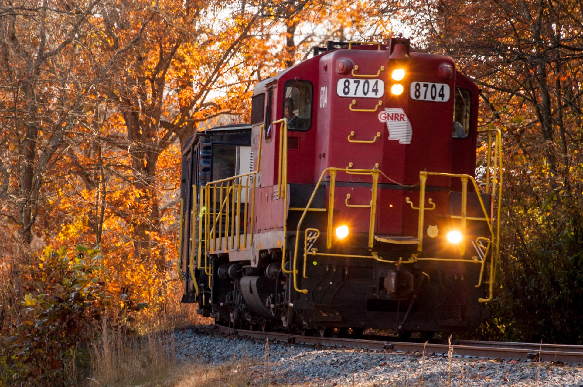 Date: 3 November 2008Location: Fannin County, Georgia, United StatesOriginal resolution: 6 MPProcessing: Processed from RAW using Adobe Photoshop Lightroom 6GNRR 8704, an EMD GP18, pulls a Blue Ridge Railroad excursion train on Georgia Northeastern track south of the grade crossing at Curtis Switch Road on its way north to McCayesville from Blue Ridge.