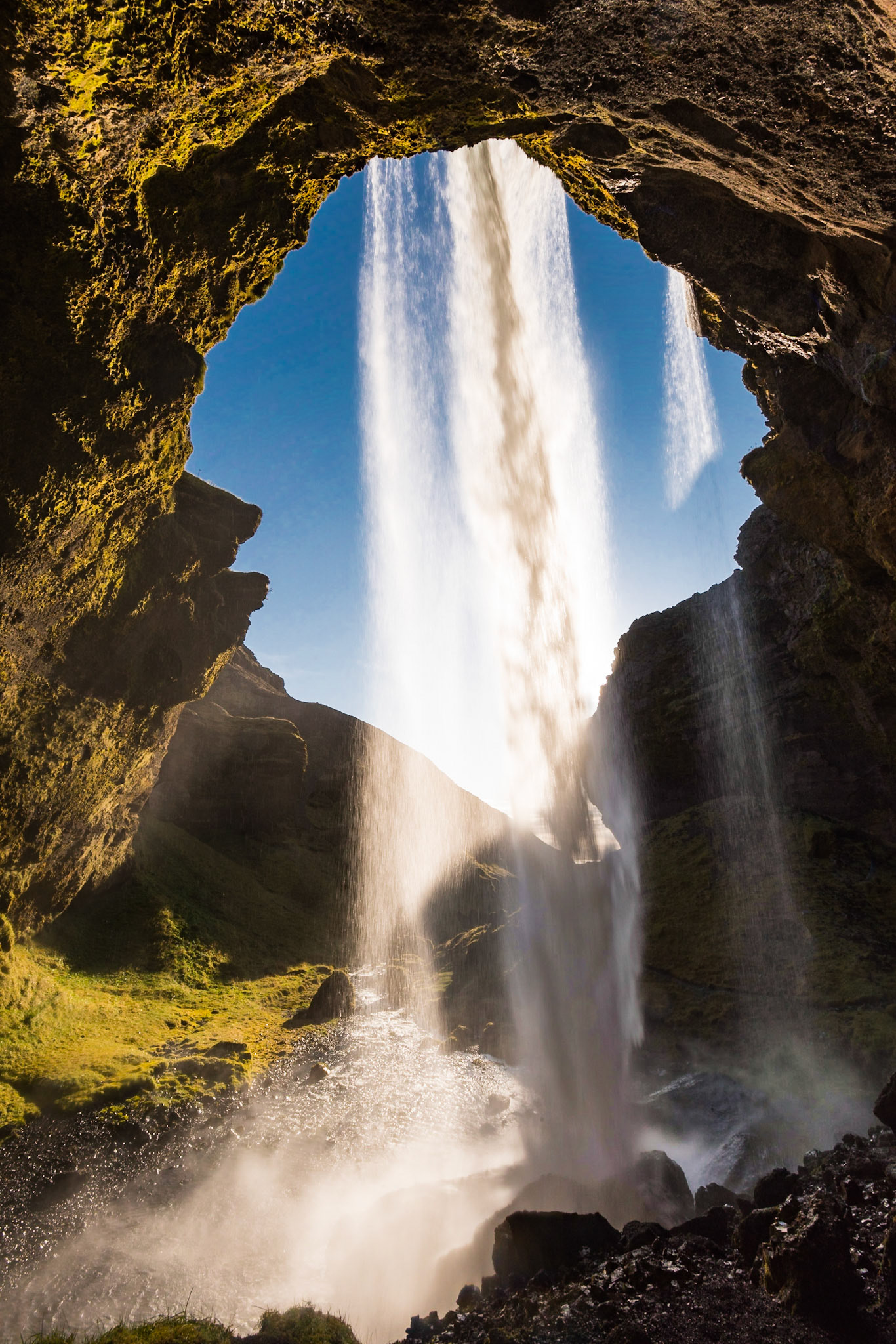 Kvernufoss sits near the more famous Skógarfoss waterfall, but at the end of a short trail. I was able to get this interesting shot of the sunlight intersecting the waterfall, with the rocks around it forming a keyhole shape.Date: 16 October 2017Location: Skógar, IcelandOriginal resolution: 36 MPProcessing: Processed from RAW using Adobe Photoshop Lightroom Classic CC 7