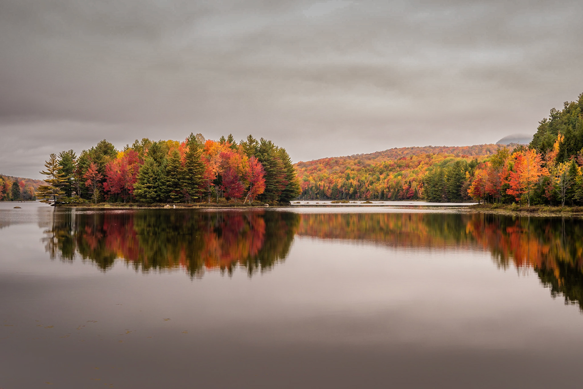 While hiking at Parc National du Mont-Orford, I could see that the reflection of the shoreline of Lake Stukely and the island in it created an inkblot pattern, so I set up this photo to have a centered horizon.Date: 8 October 2018Location: Orford, Québec, CanadaOriginal resolution: 36 MPProcessing: Processed from RAW using Adobe Photoshop Lightroom Classic CC 7