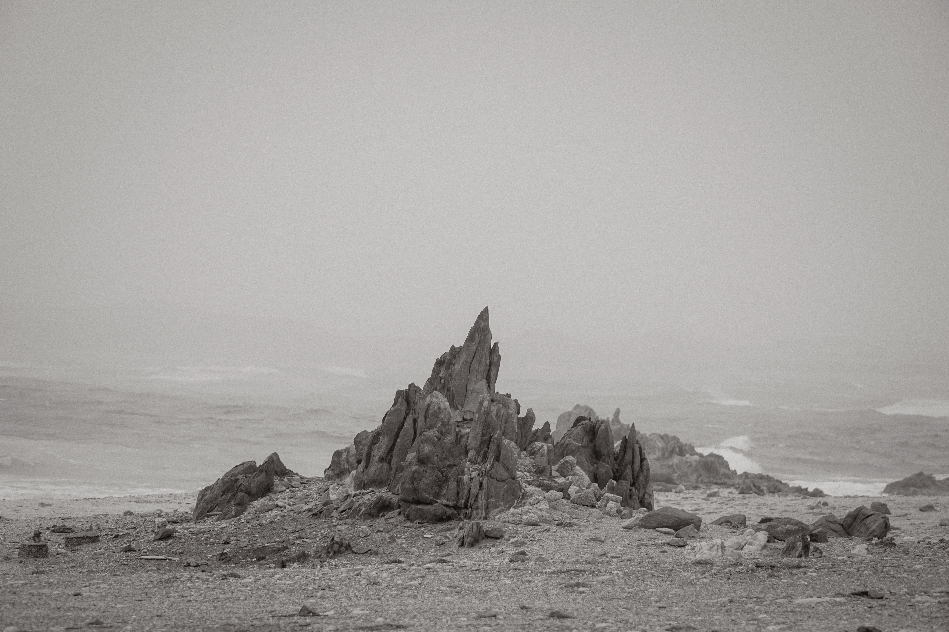 Rock spire against the sea