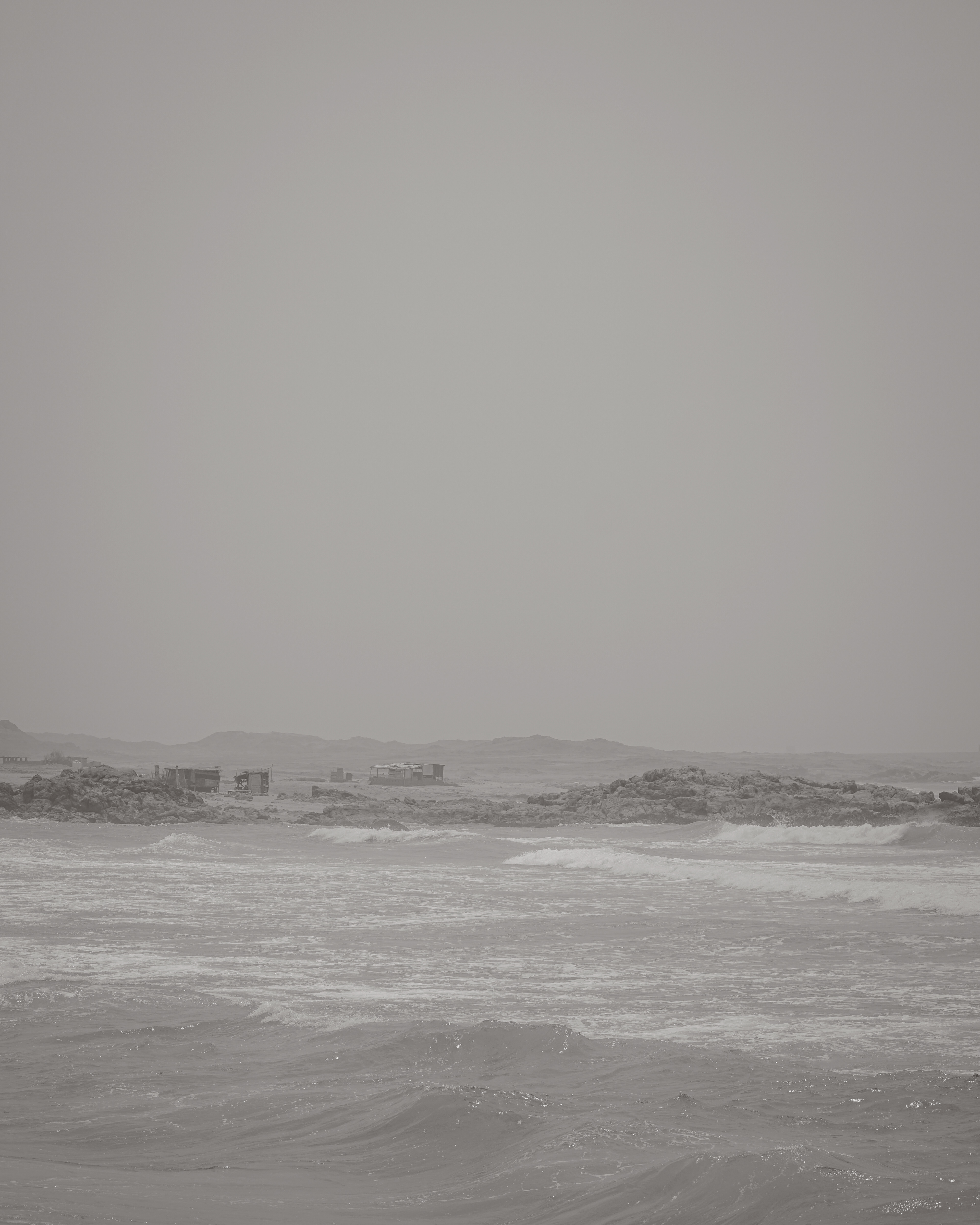 Mirbat coast and distant ruins