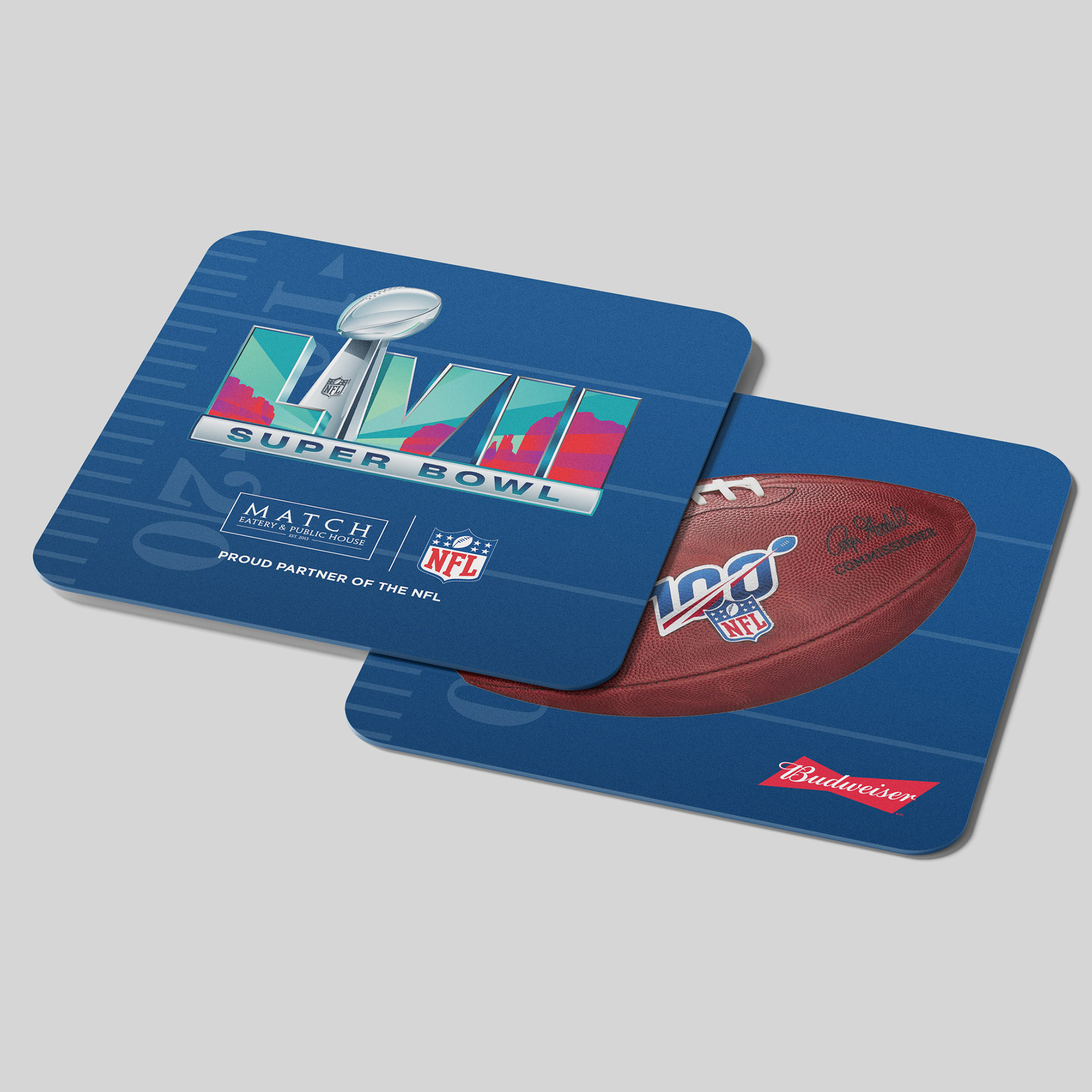 Two square coasters — one with Super Bowl LVIII logo, one with an NFL 100th-season football and Budweiser logo