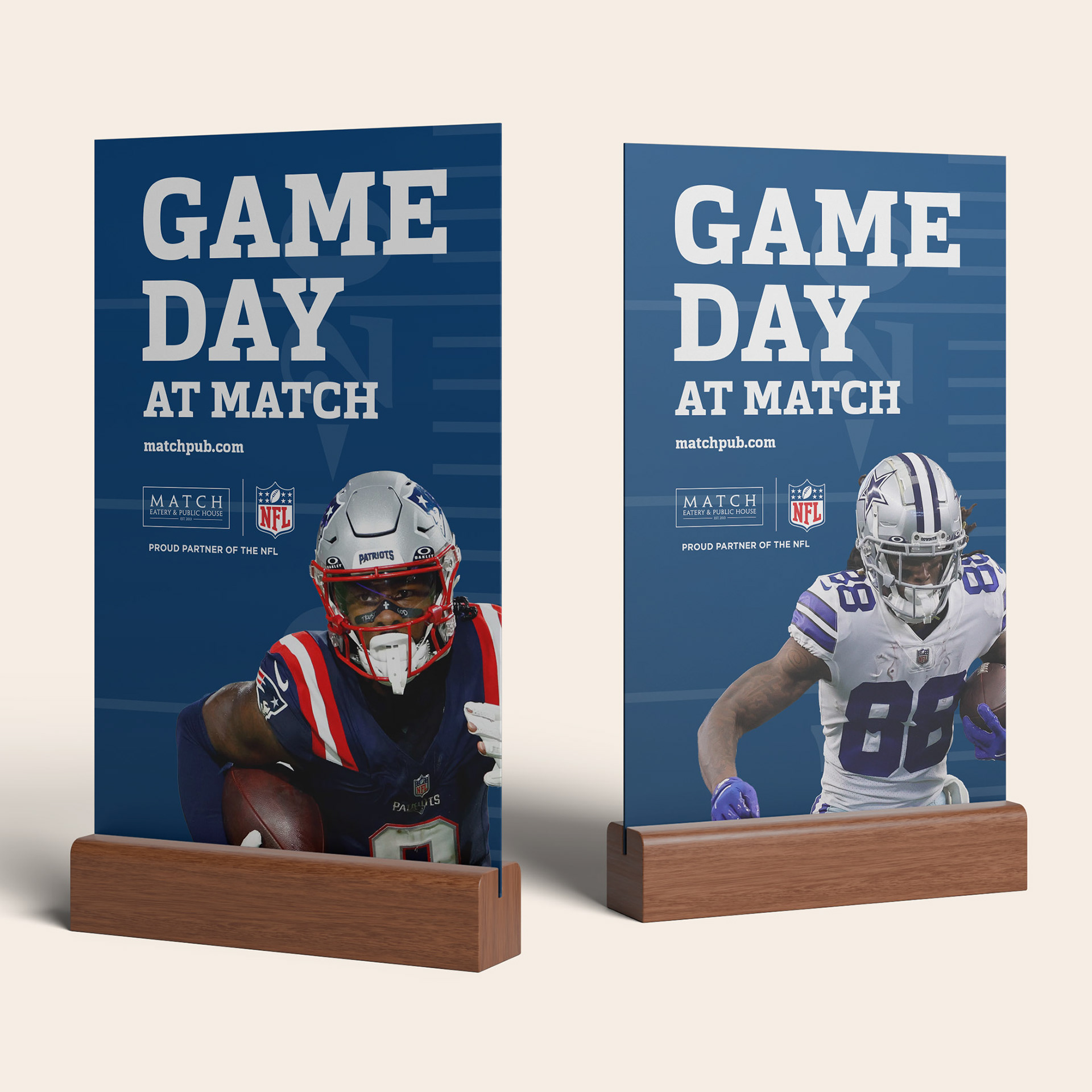 Two tabletop table-tent signs on wood bases, each reading "Game Day at Match" with a different NFL player photo