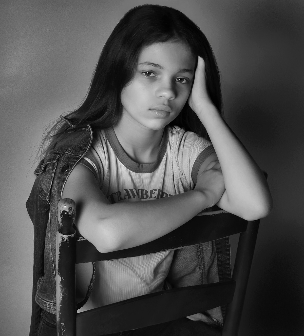 A silent strength radiates from her gaze, frozen in timeless black and white.