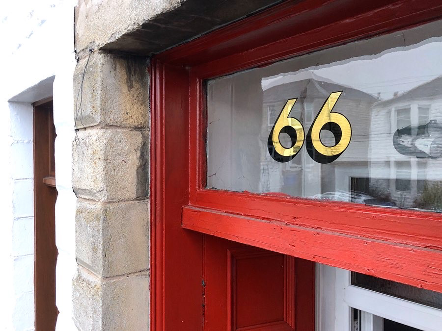 Sans serif number on transom window