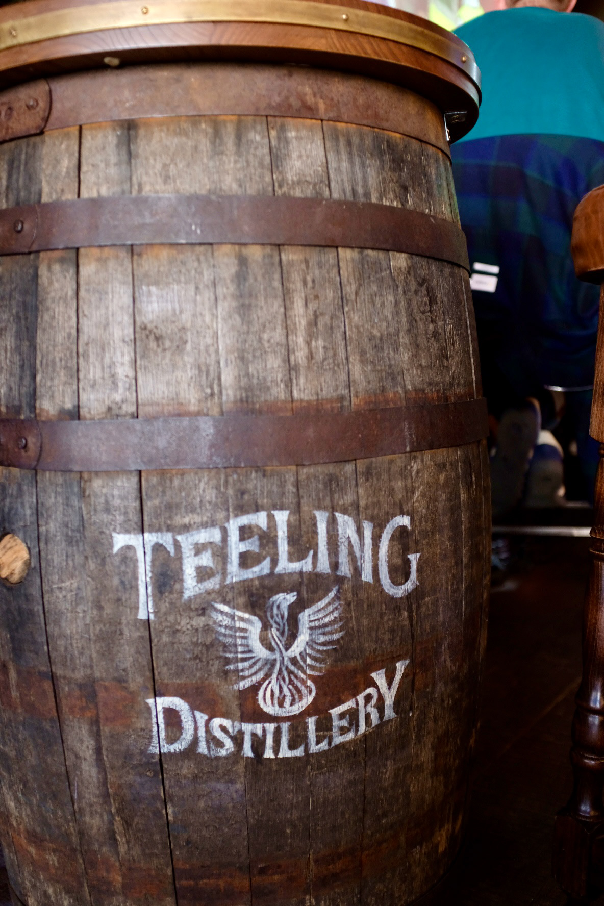 Aged logos on whiskey barrel tables