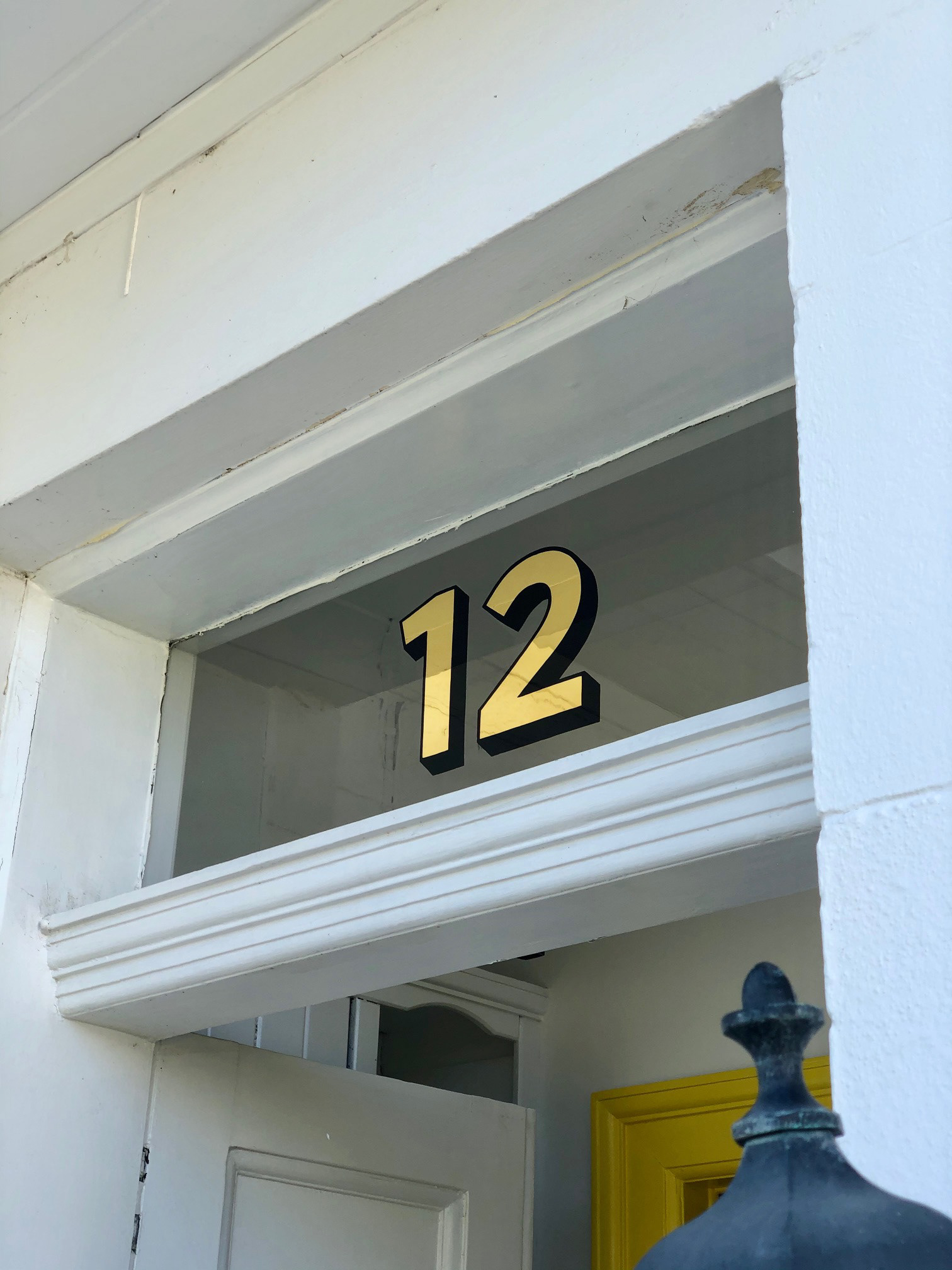 Sans serif number on transom window