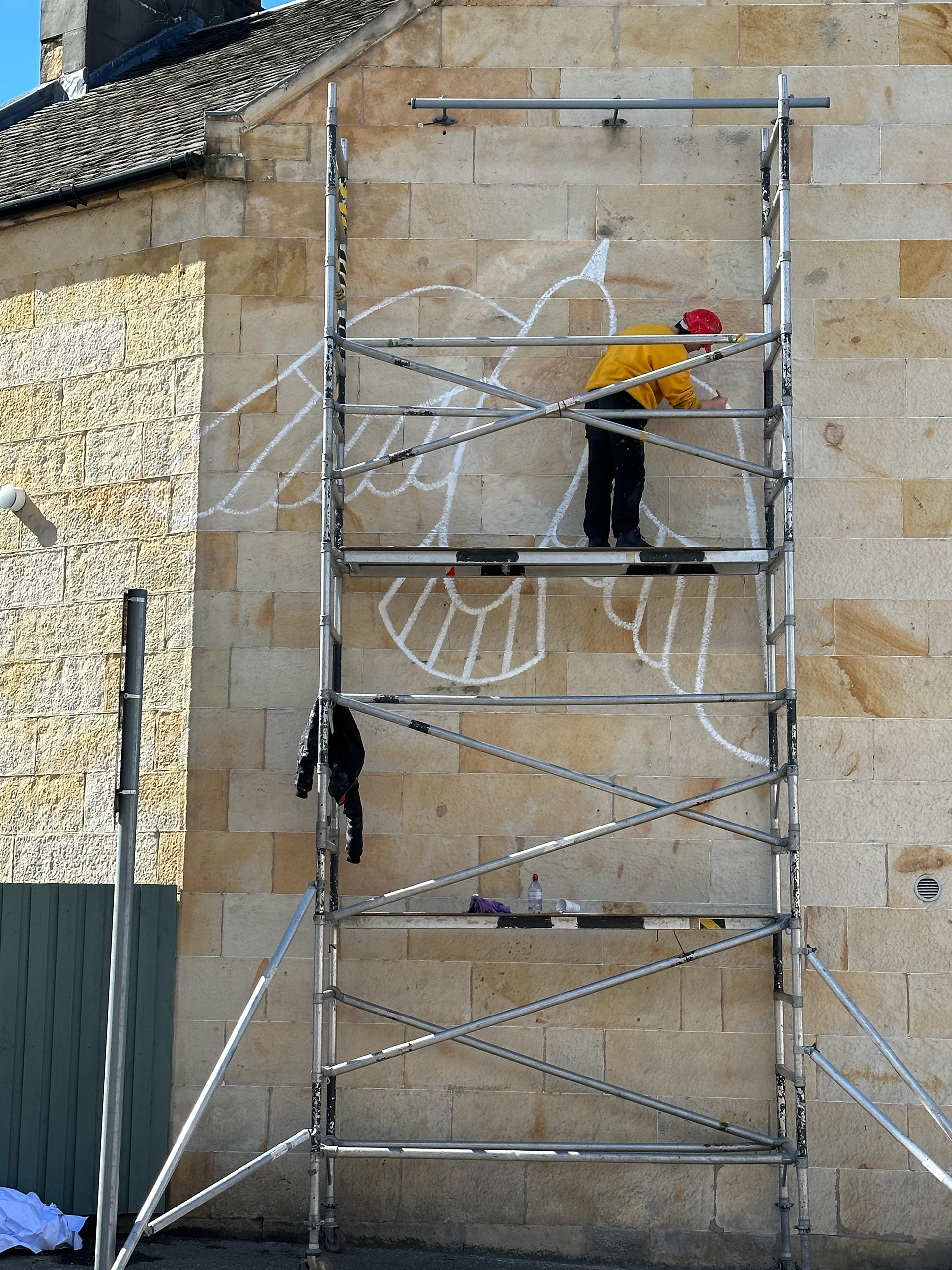Icon painted onto exterior sandstone