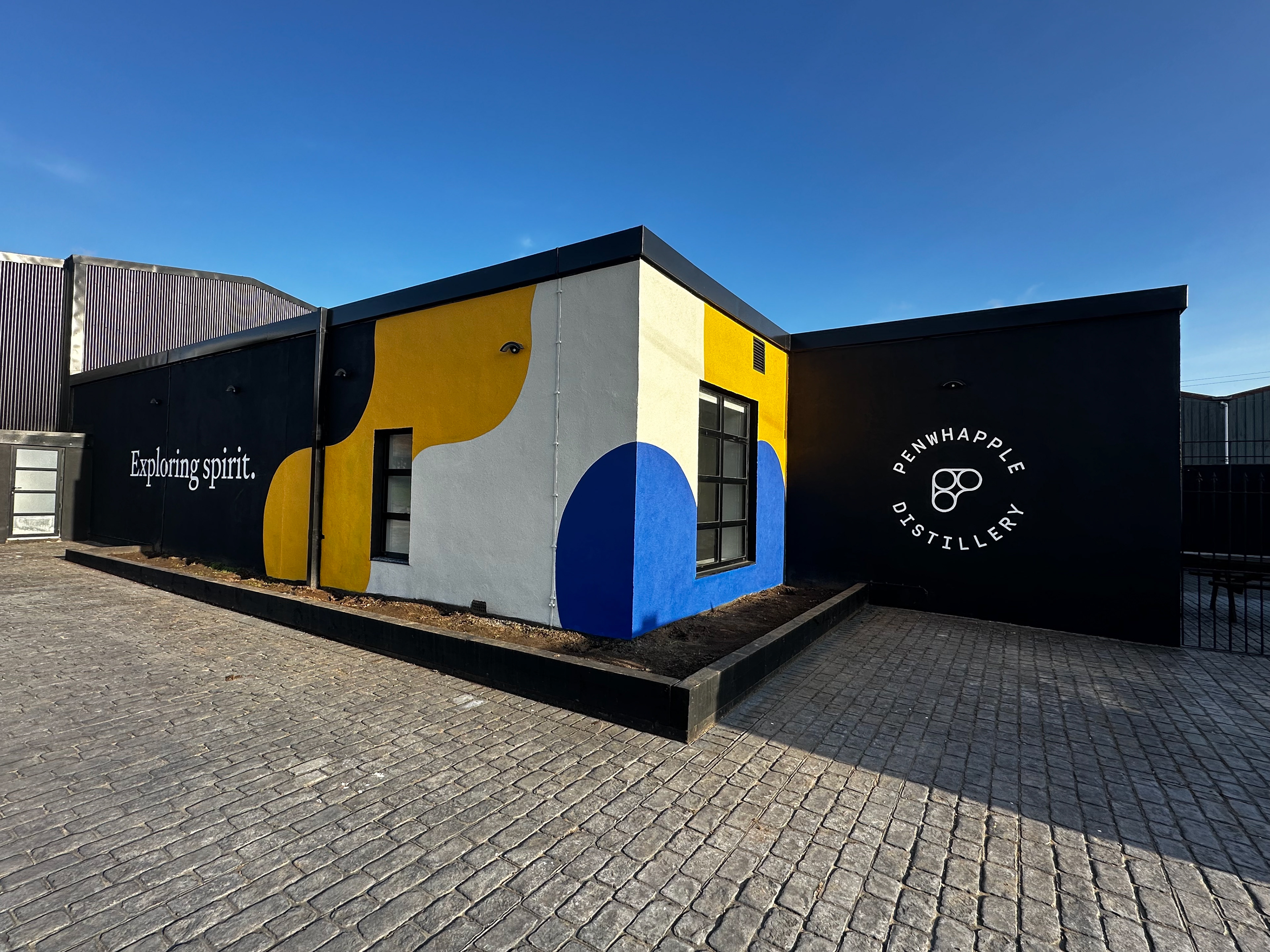 Mural and branding painted across the building